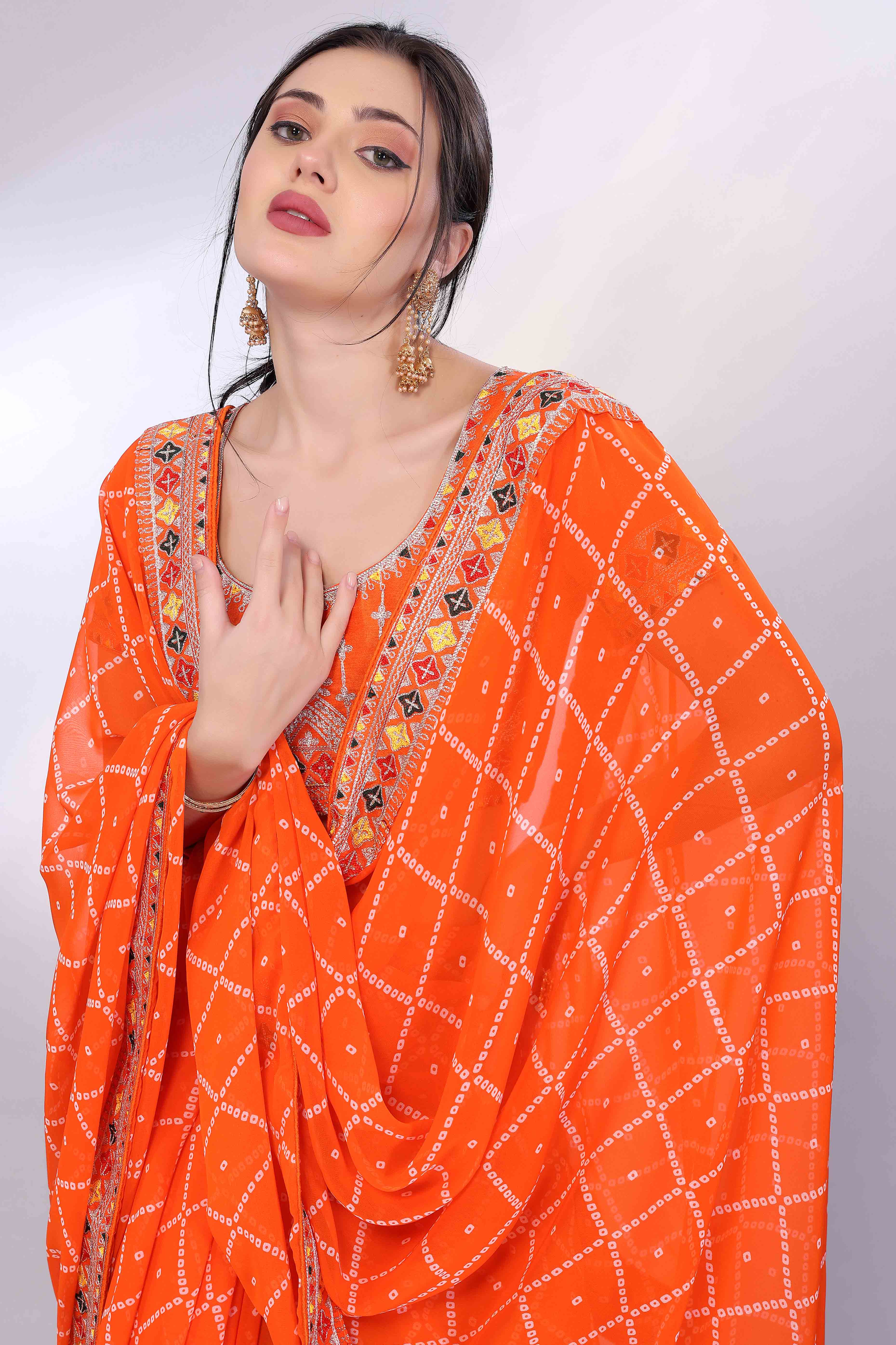 Orange Bandhani Printed Georgette Saree Framed With Elegant Embroidered Border