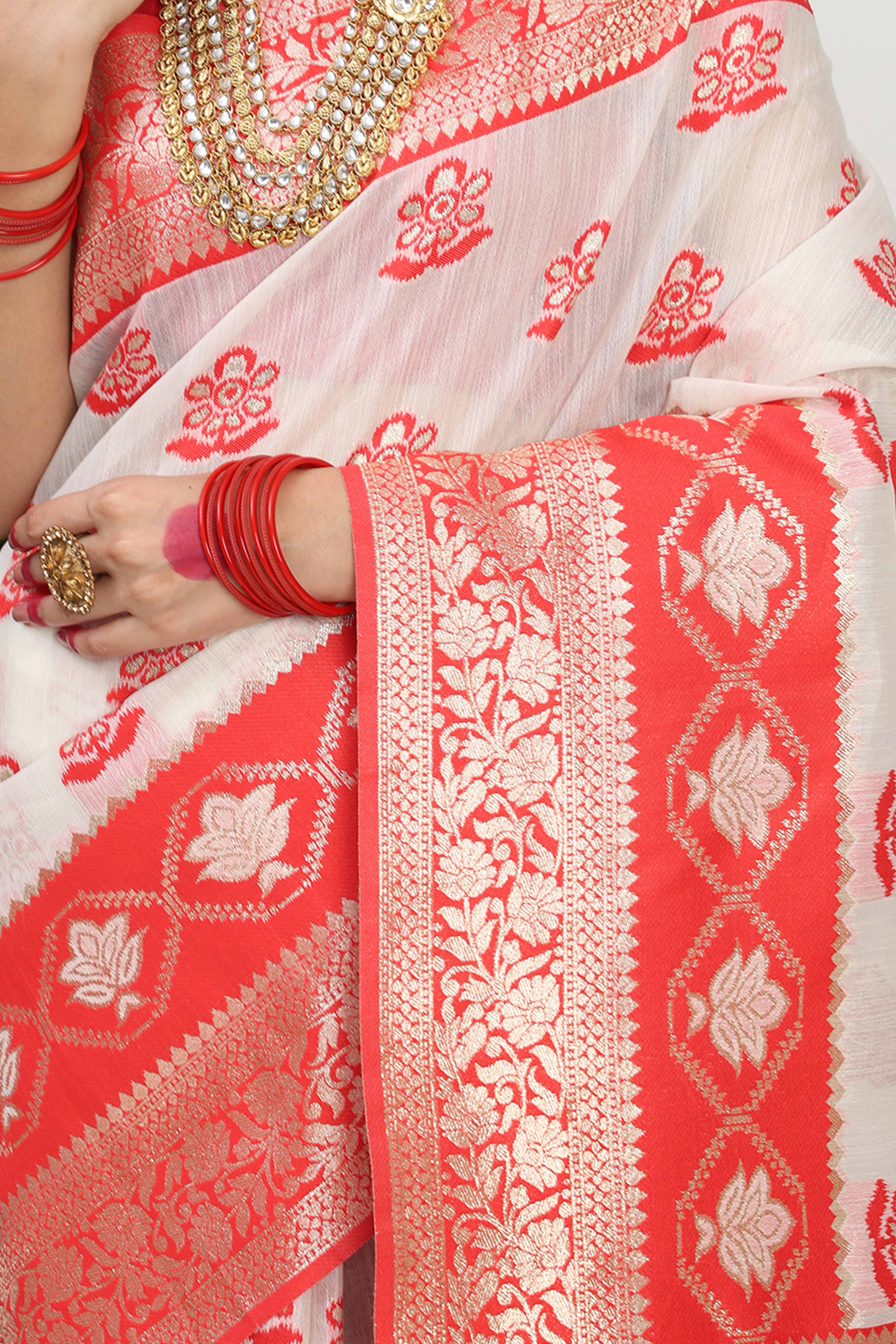 Chic White & Red Saree In Linen Cotton Flaunting Traditional Zari Weaving And A Tasselled Edge