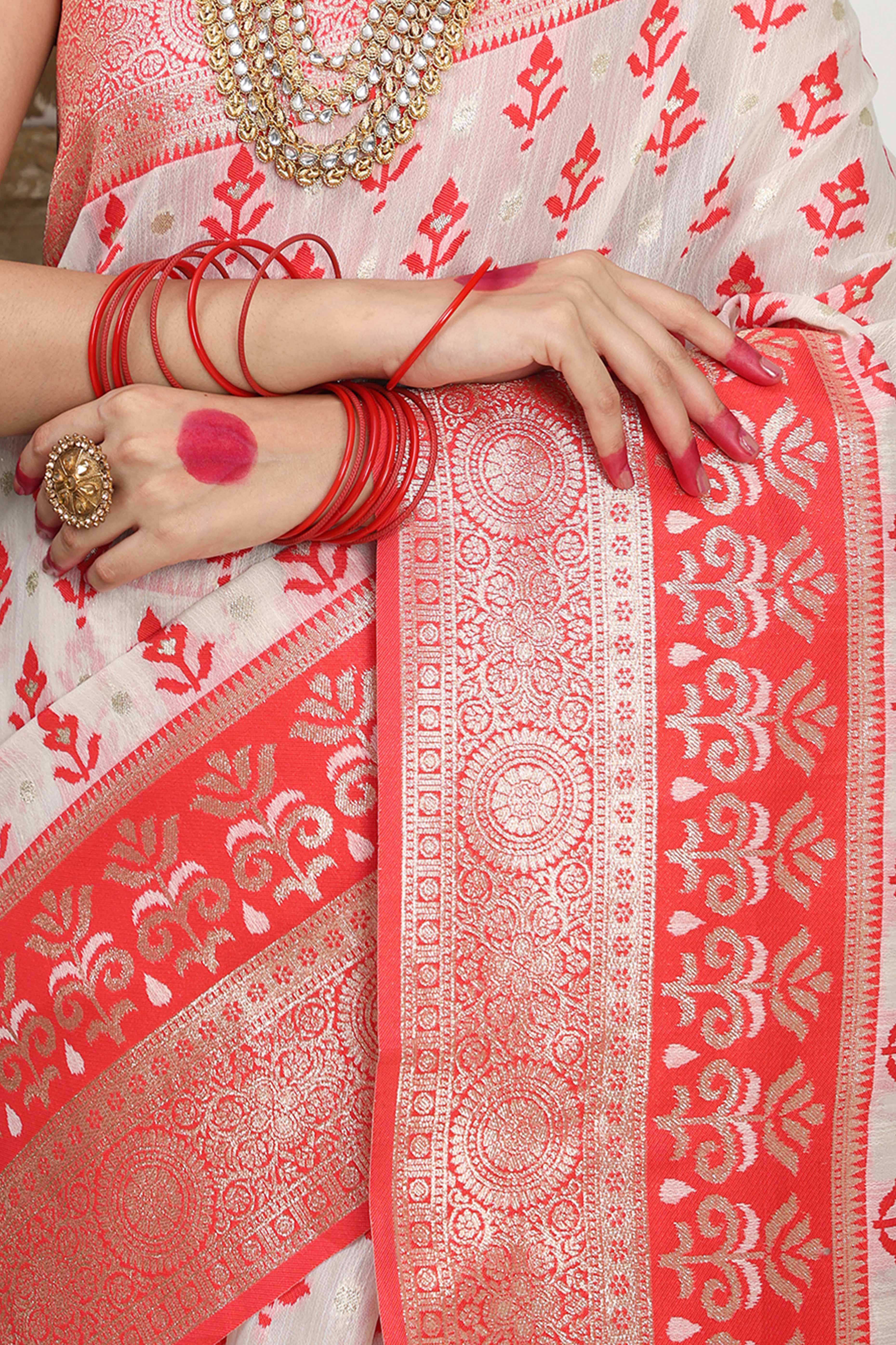 White & Red Linen Cotton Saree Showcasing Elegant Zari Weaving And A Tassel-Embellished Pallu