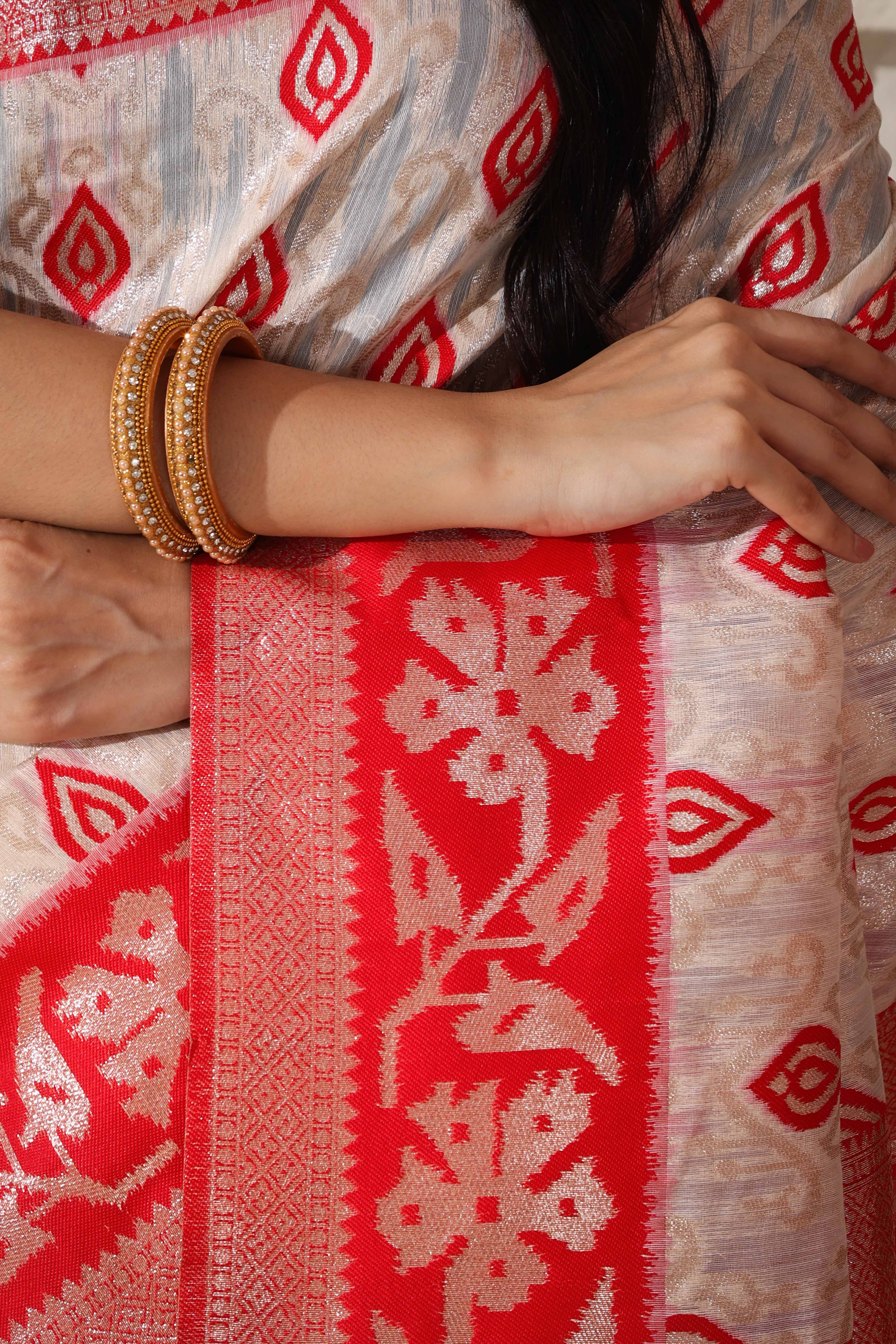 Classic White & Red Saree In Linen Cotton With Rich Zari Weaving And Tassel Accents