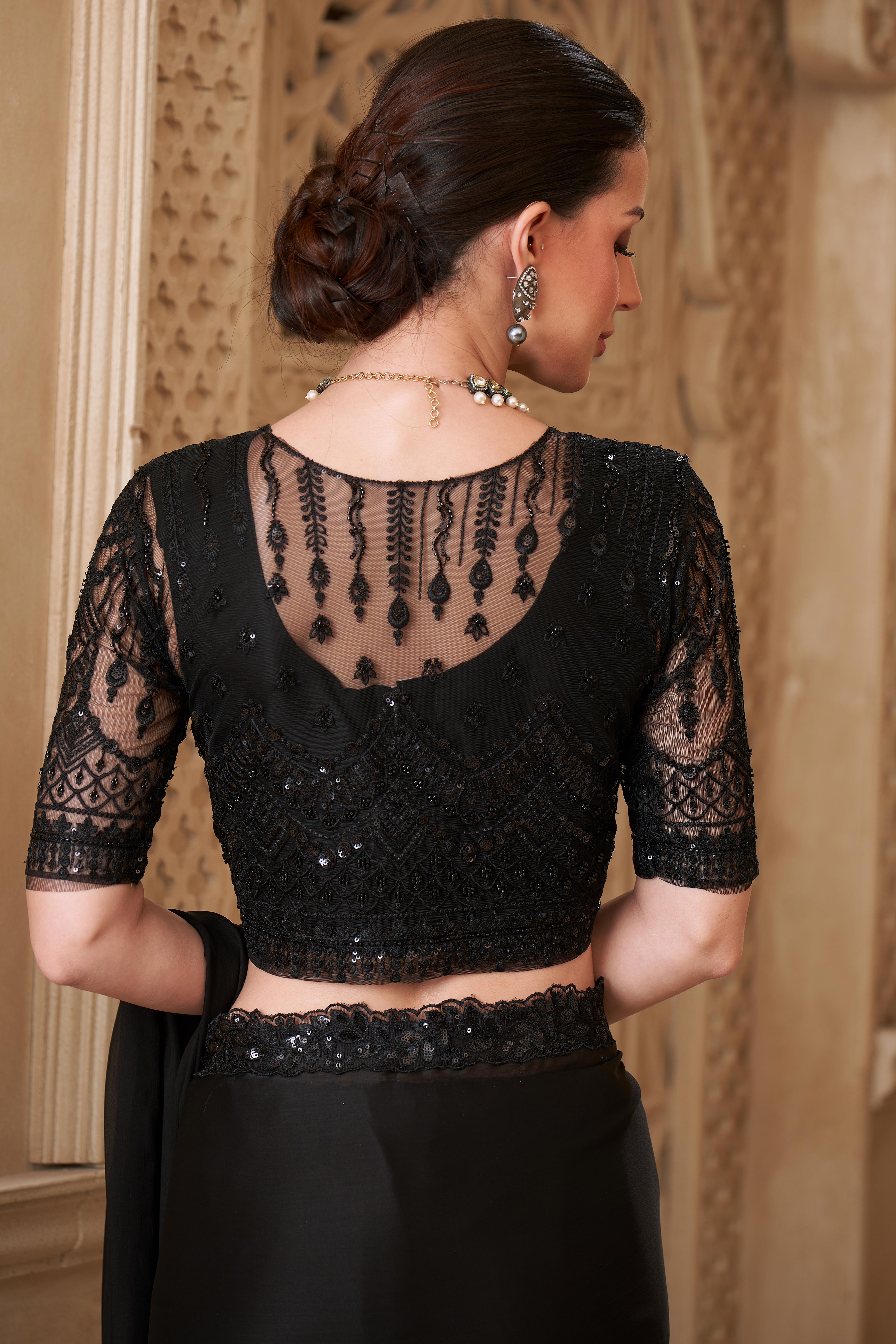 Shimmering Black Georgette Saree with Graceful Thread Embellishment and Sequins