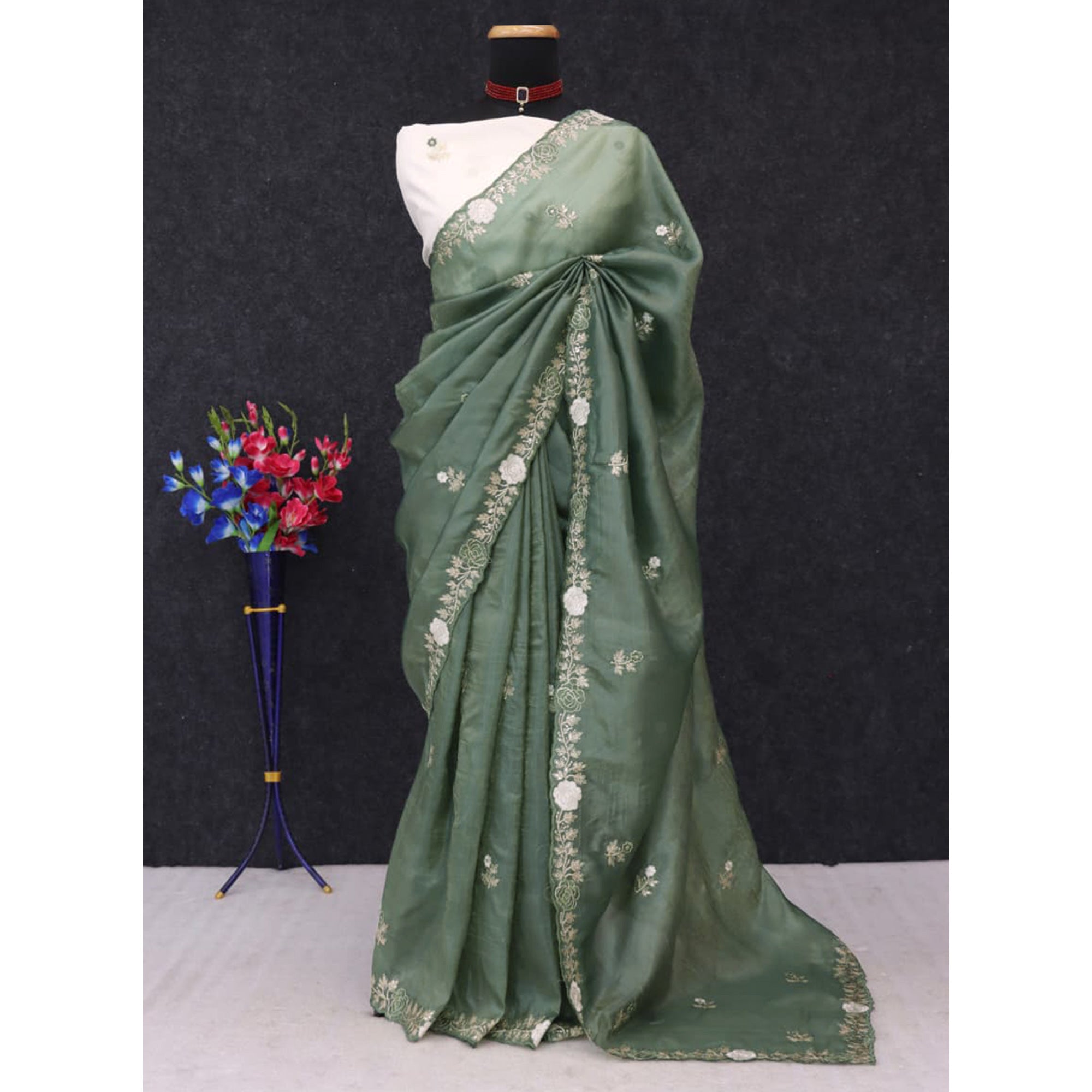 Green Lightweight Georgette Crush Saree Adorned with Delicate Floral Embroidery
