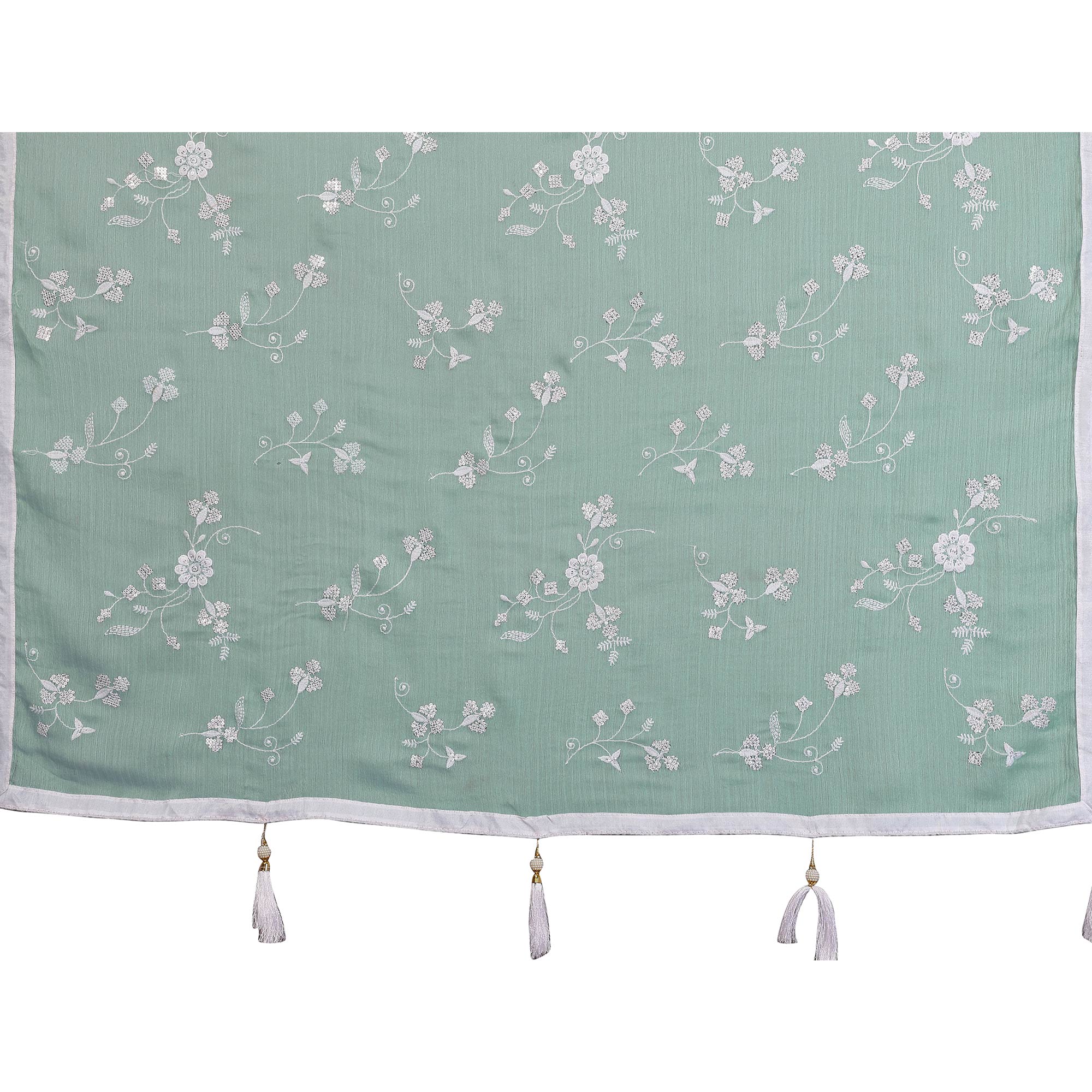 Pale Turquoise Bloom Saree adorned with Moss Floral Embroidery and Delicate Lace Border