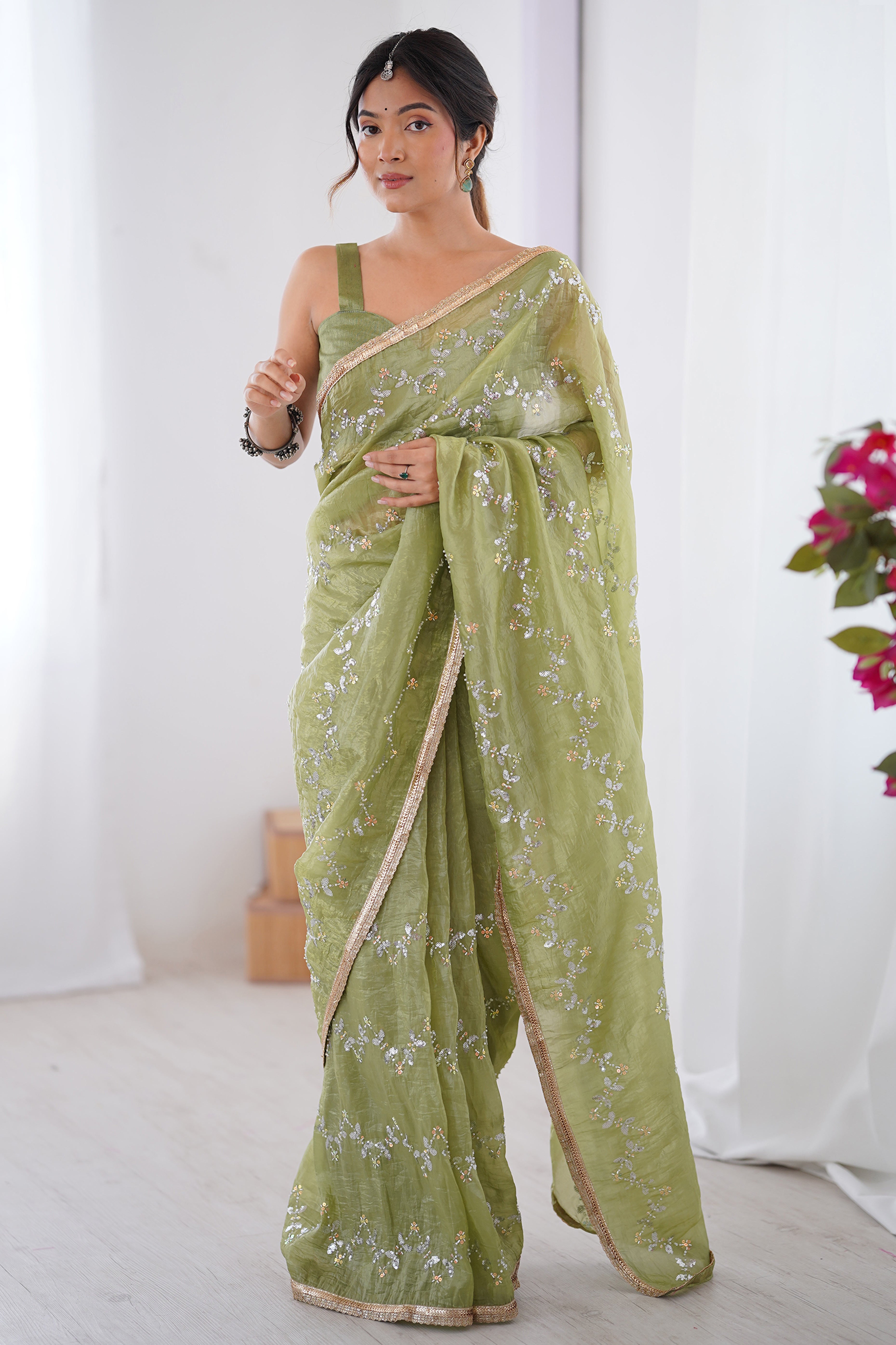 Dazzling Pista Green Organza Saree Accented with Sequin, Bead & Stone Work and Delicate Lace Detailing