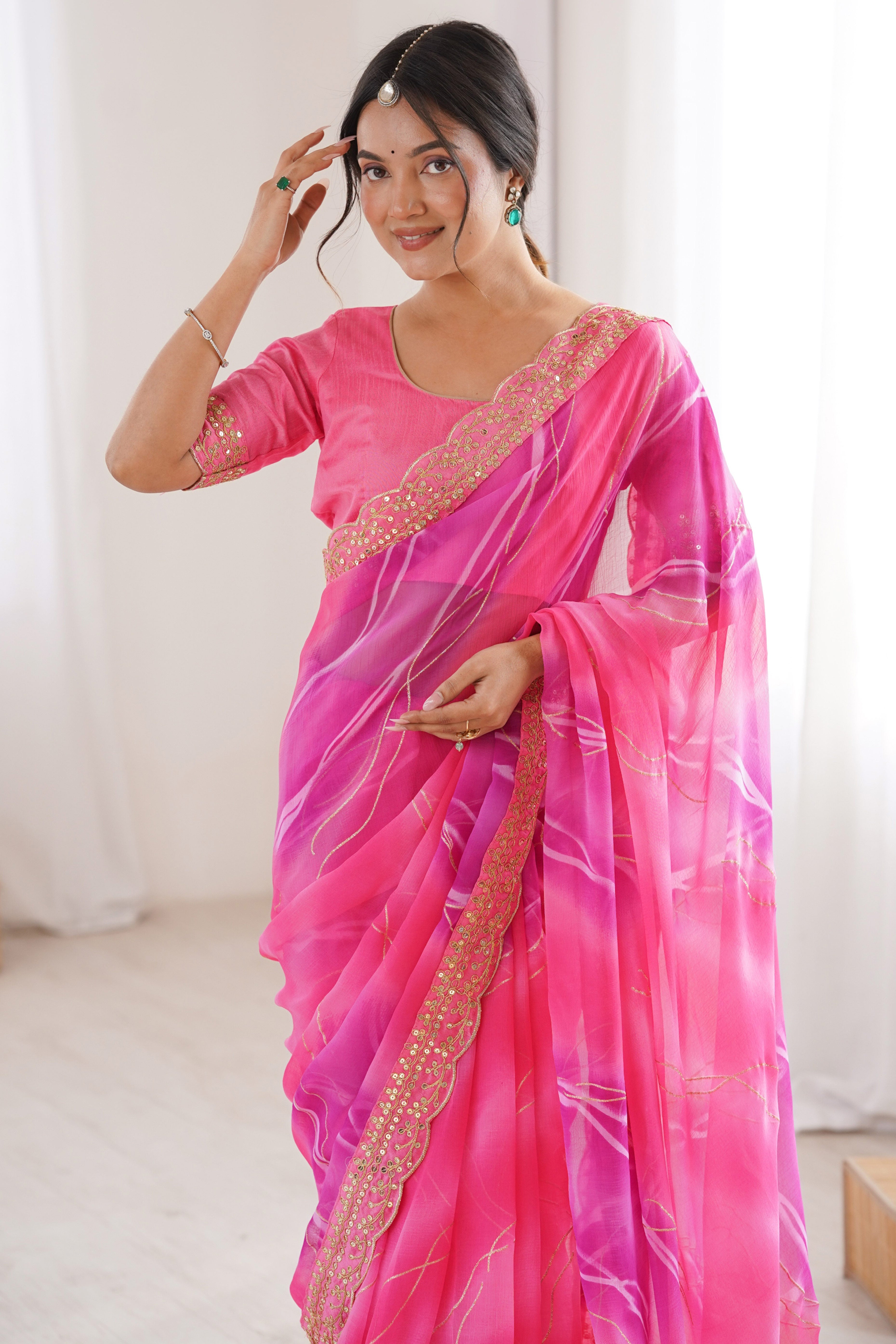 Graceful Pink Foil Print Georgette Saree Featuring A Luxurious Cording Sequins Embroidered Border