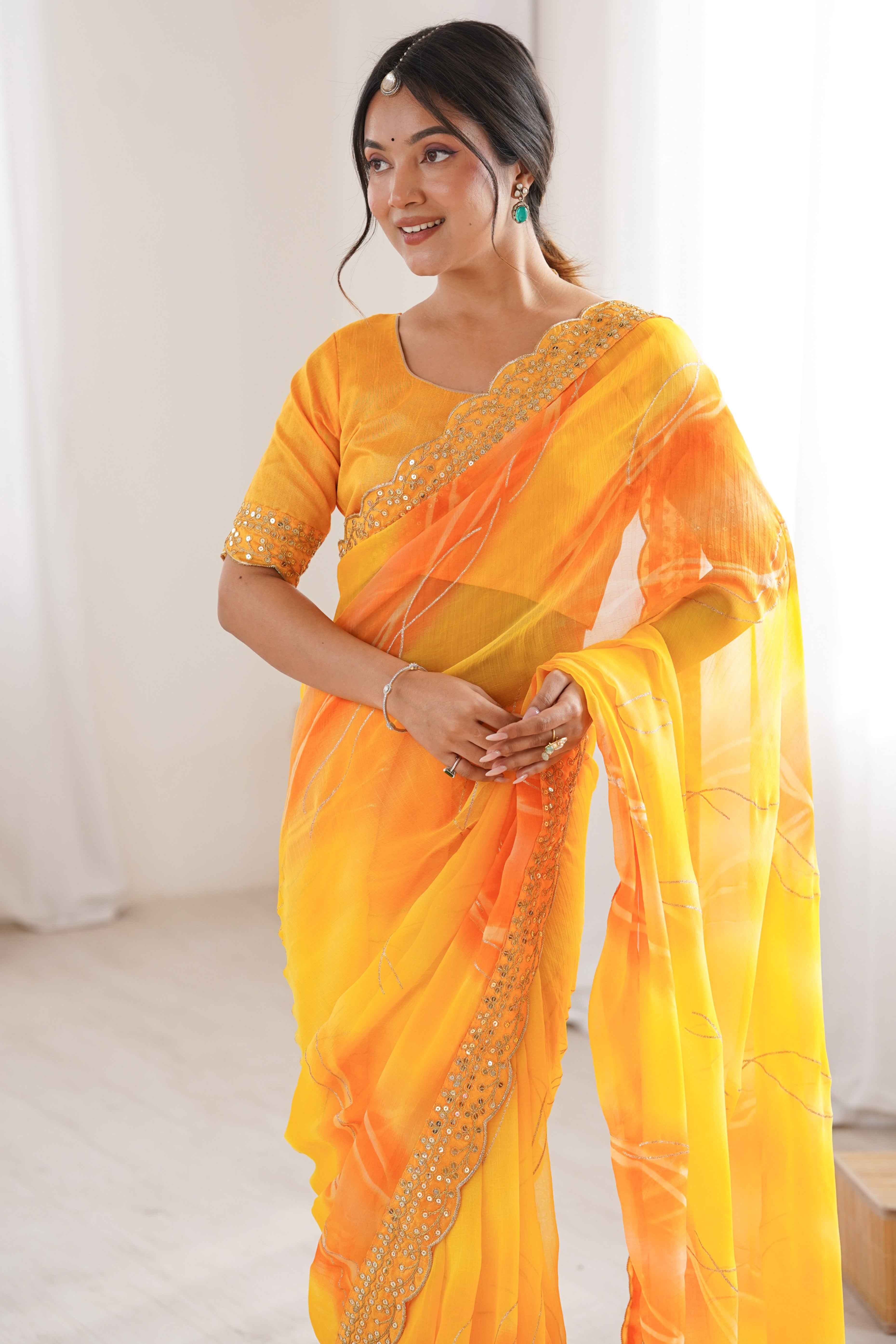 Graceful Yellow Foil Print Georgette Saree Featuring A Luxurious Cording Sequins Embroidered Border