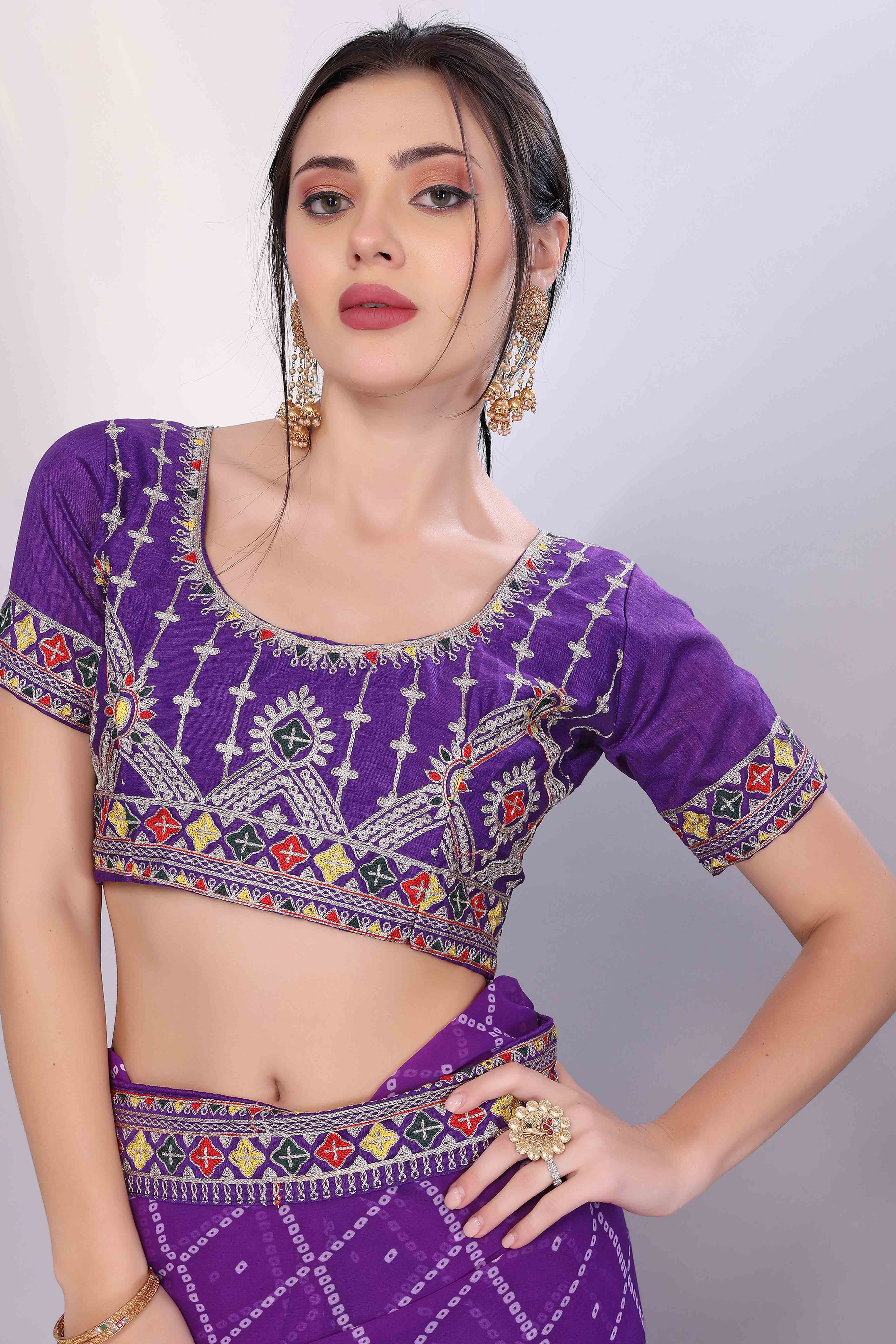 Purple Bandhani Printed Georgette Saree Framed With Elegant Embroidered Border