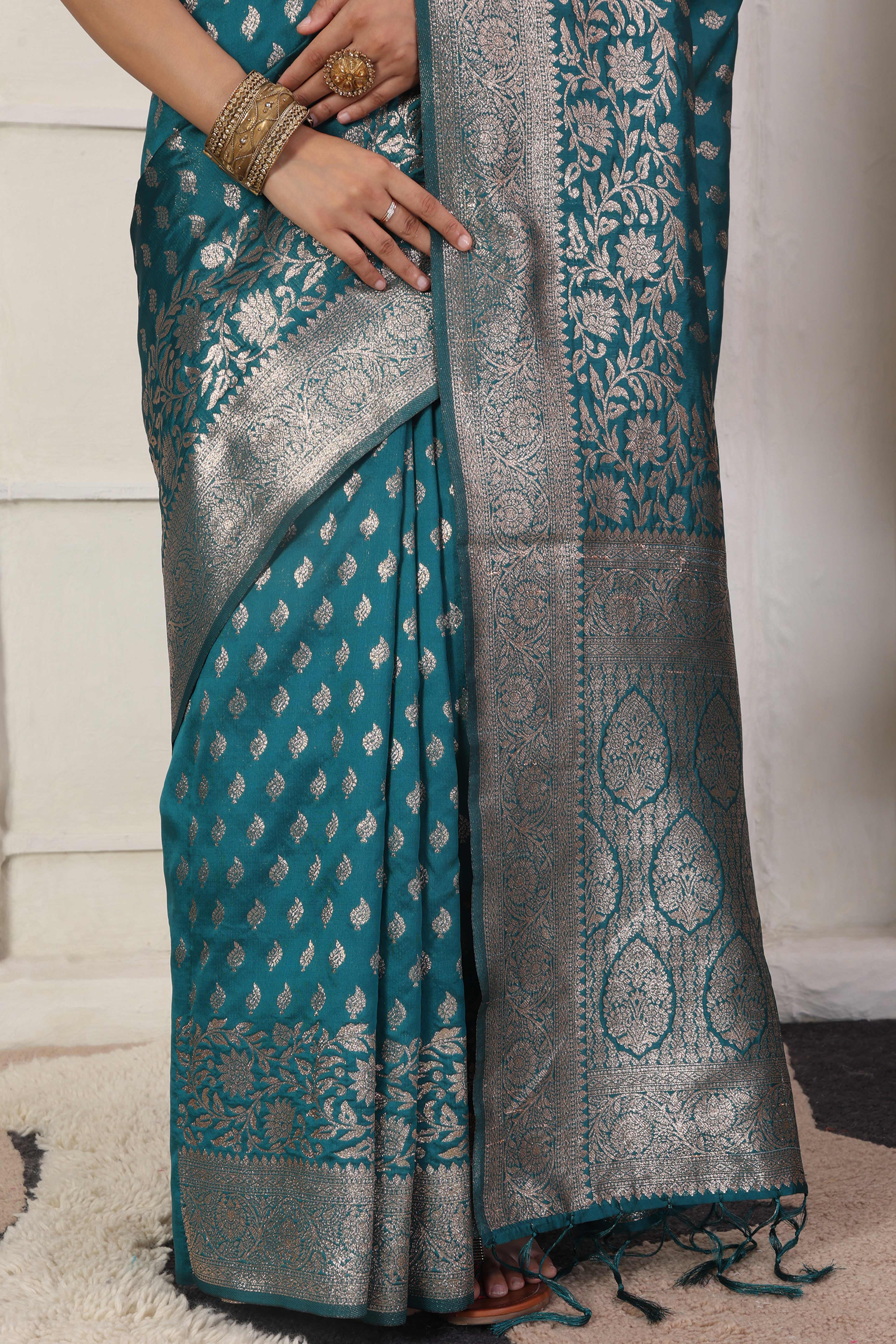 Rama Blue Traditional Lichi Silk Blend Saree Enhanced With Floral Zari Weaving & Tassel Pallu