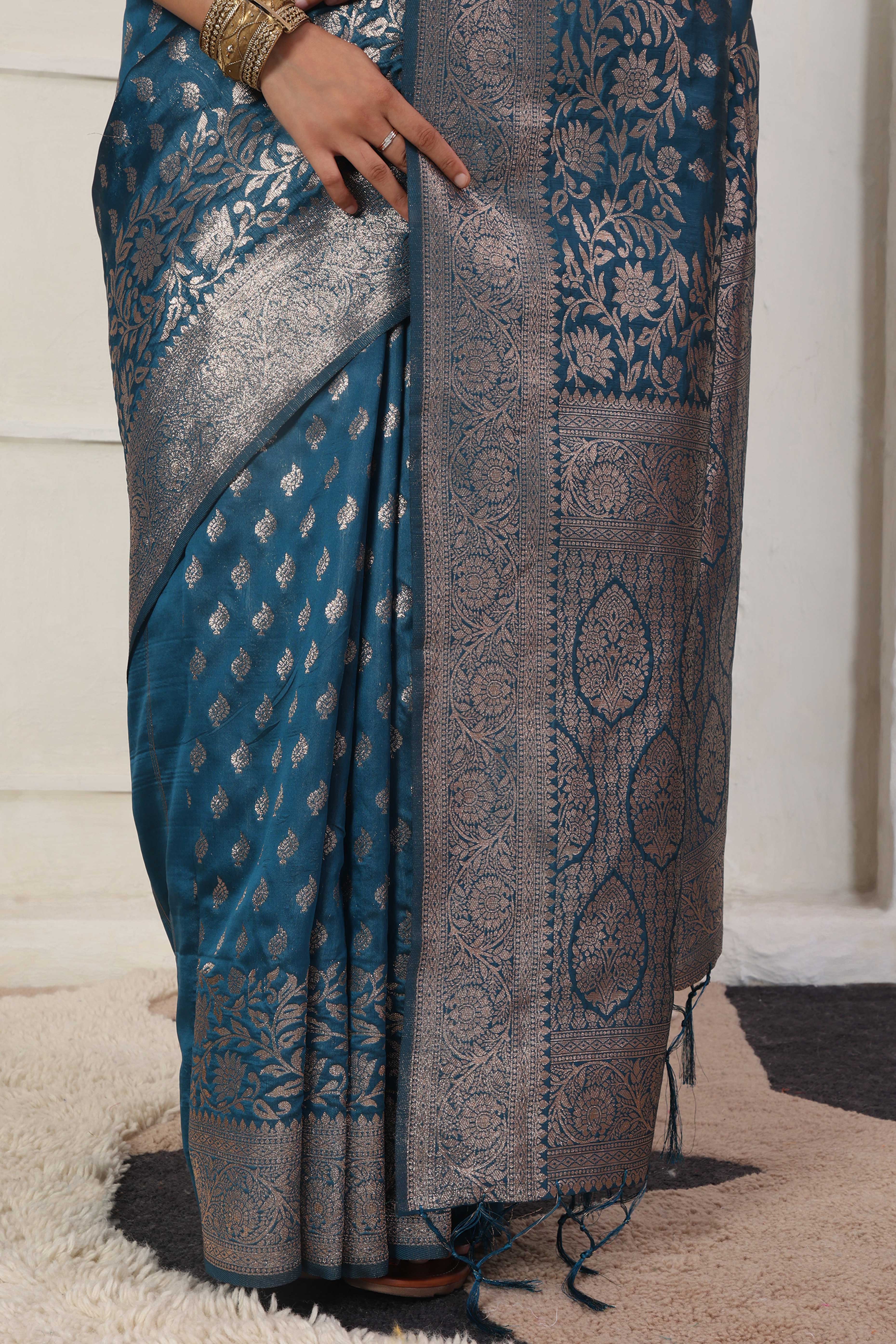 Blue Traditional Lichi Silk Blend Saree Enhanced With Floral Zari Weaving & Tassel Pallu