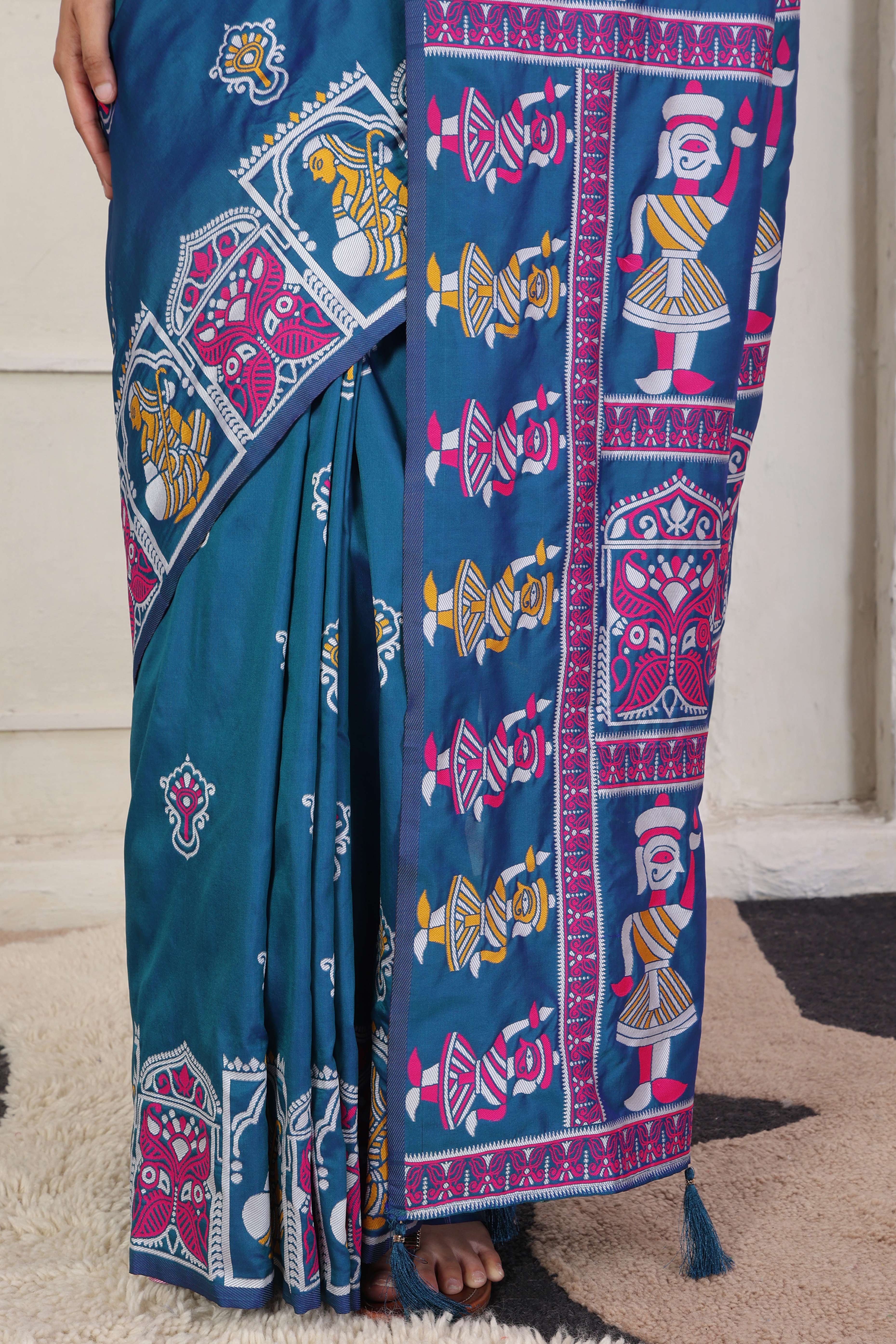 Teal Blue Ethnic Madhubani Print Silk Blend Saree Enhanced With Tassel Pallu Accents