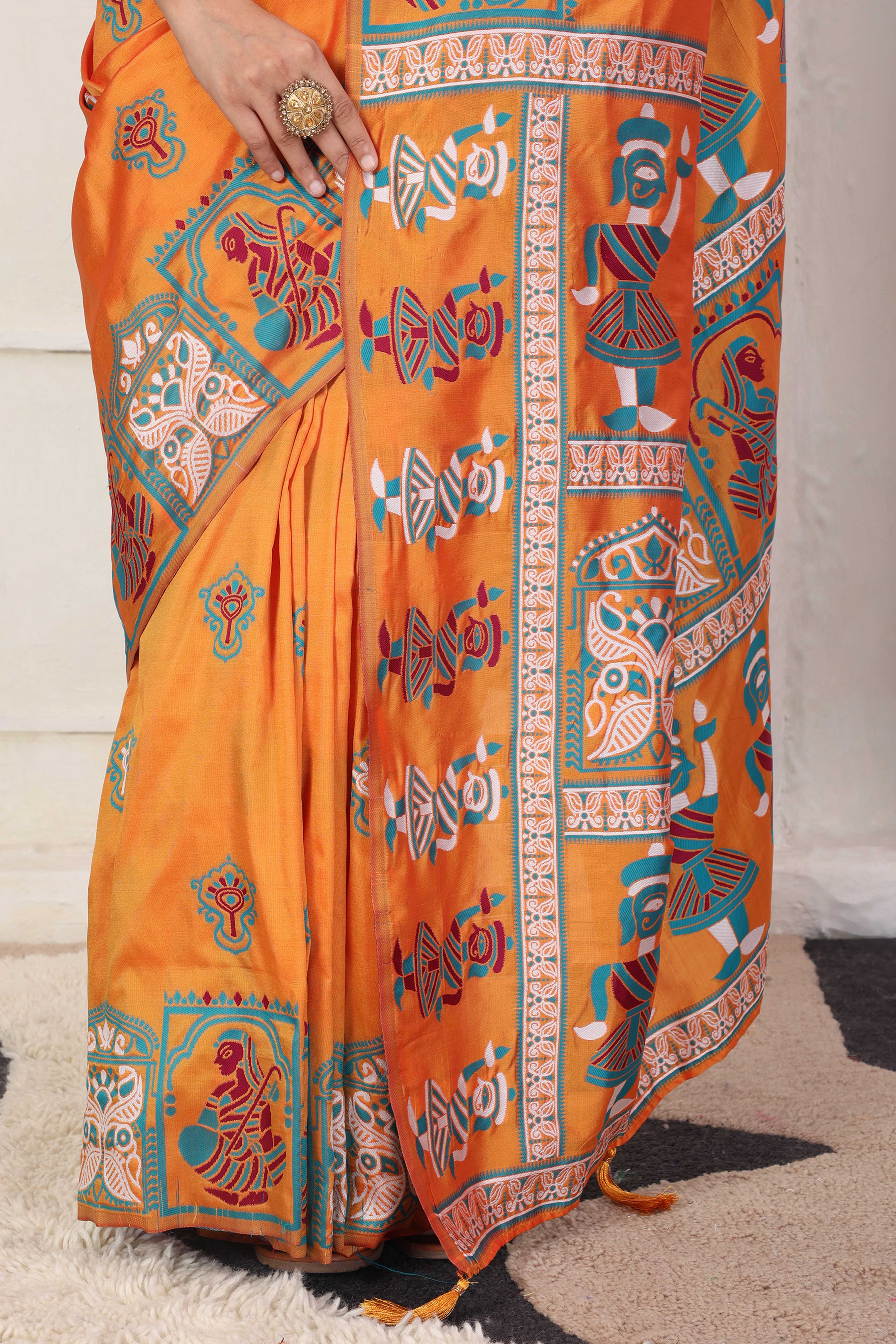 Orange Ethnic Madhubani Print Silk Blend Saree Enhanced With Tassel Pallu Accents