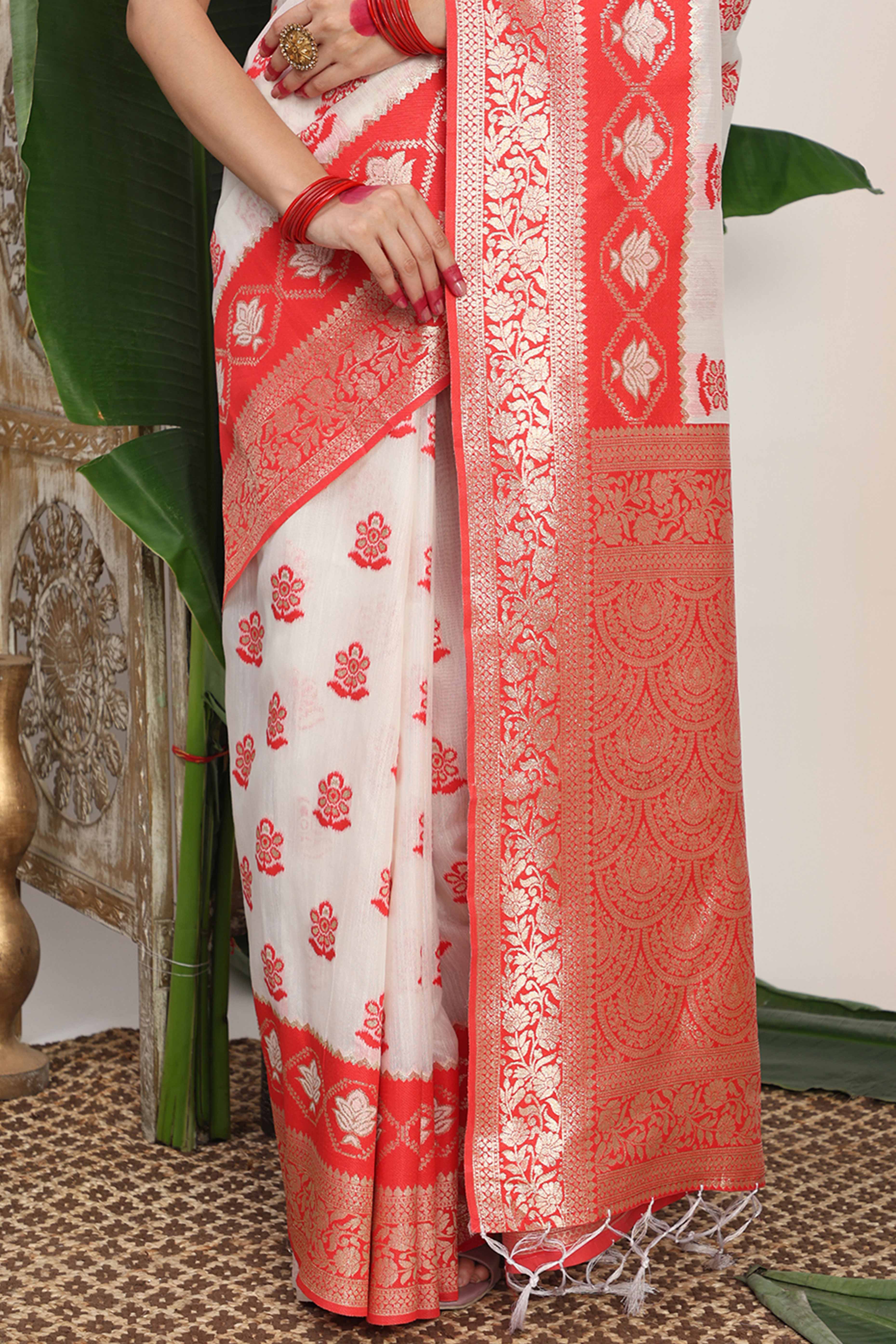 Chic White & Red Saree In Linen Cotton Flaunting Traditional Zari Weaving And A Tasselled Edge
