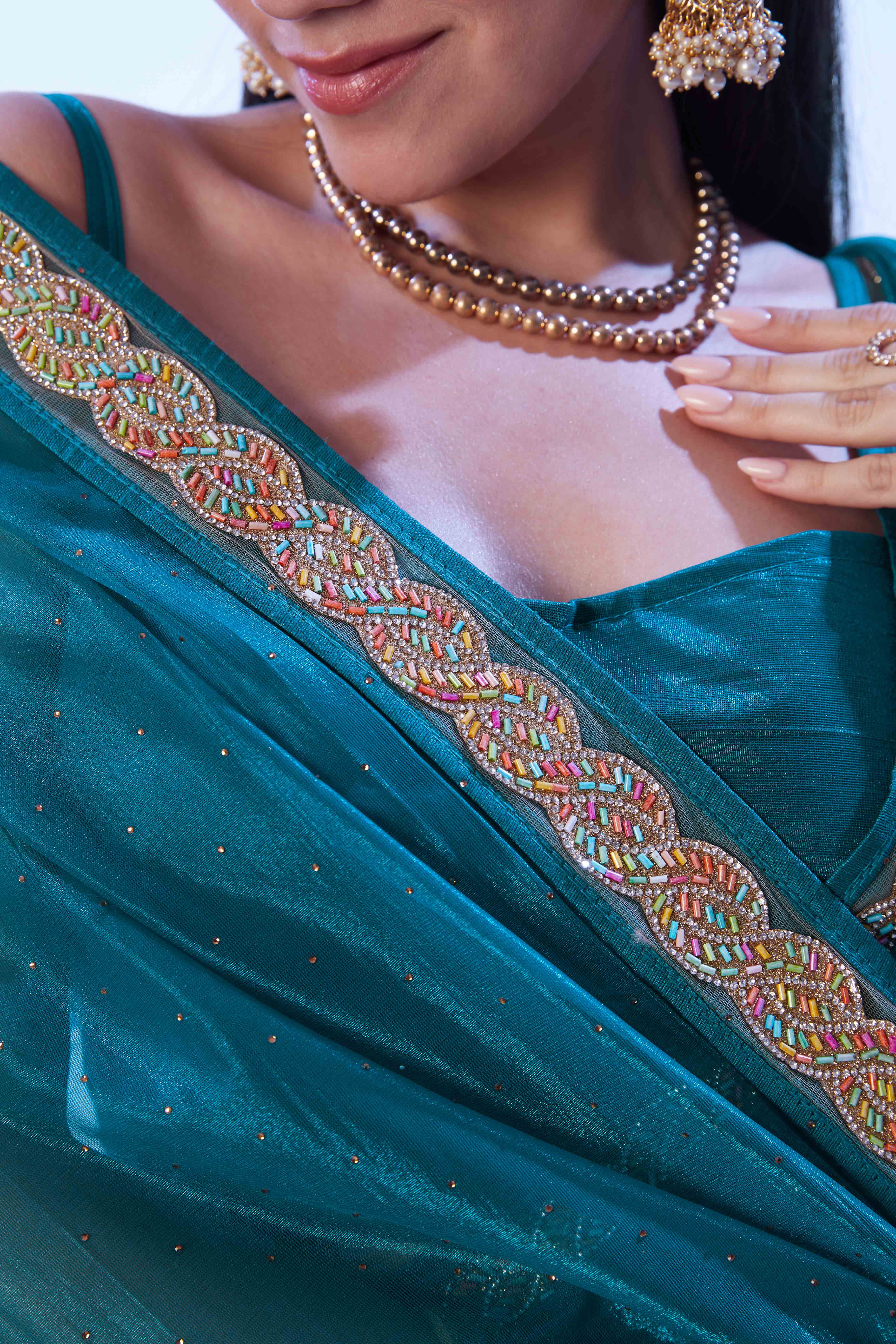 Teal Stone Work Net Solid Embroidered Saree for Party Wear