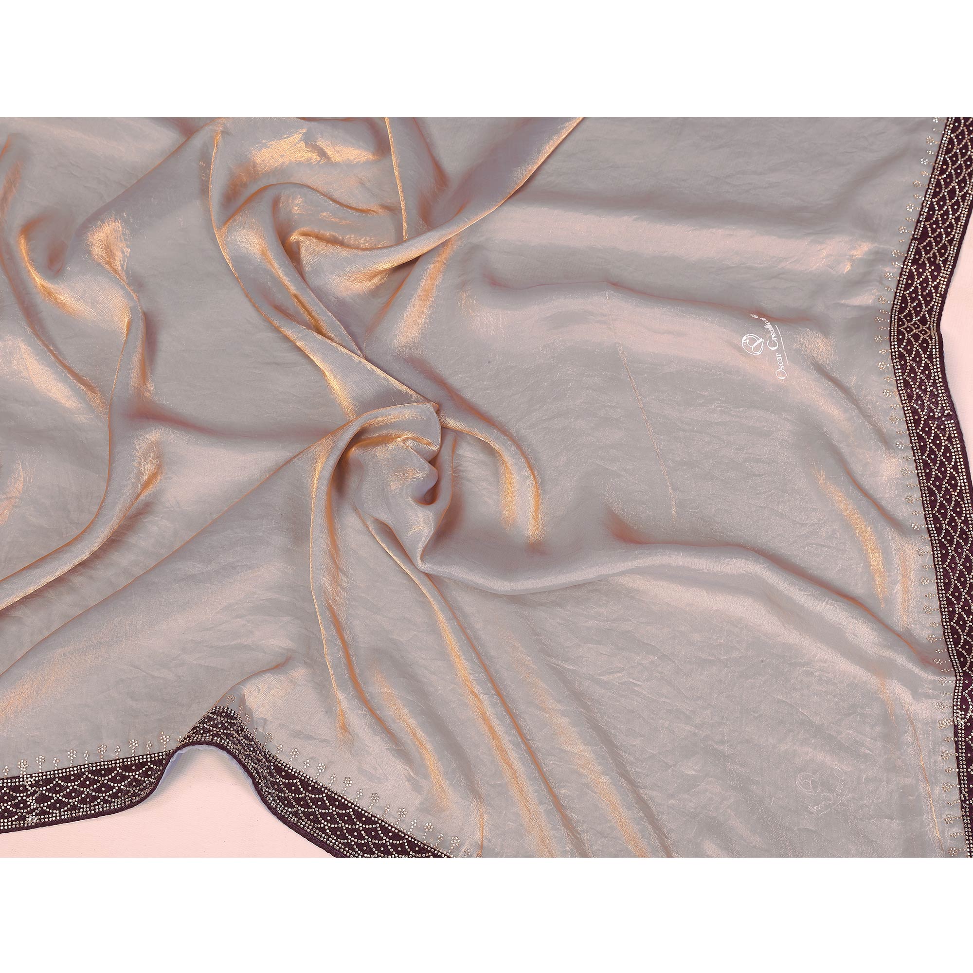 Grey Fancy Satin Saree Featuring a Solid Body and Sparkling Jarkan Work on the Edges