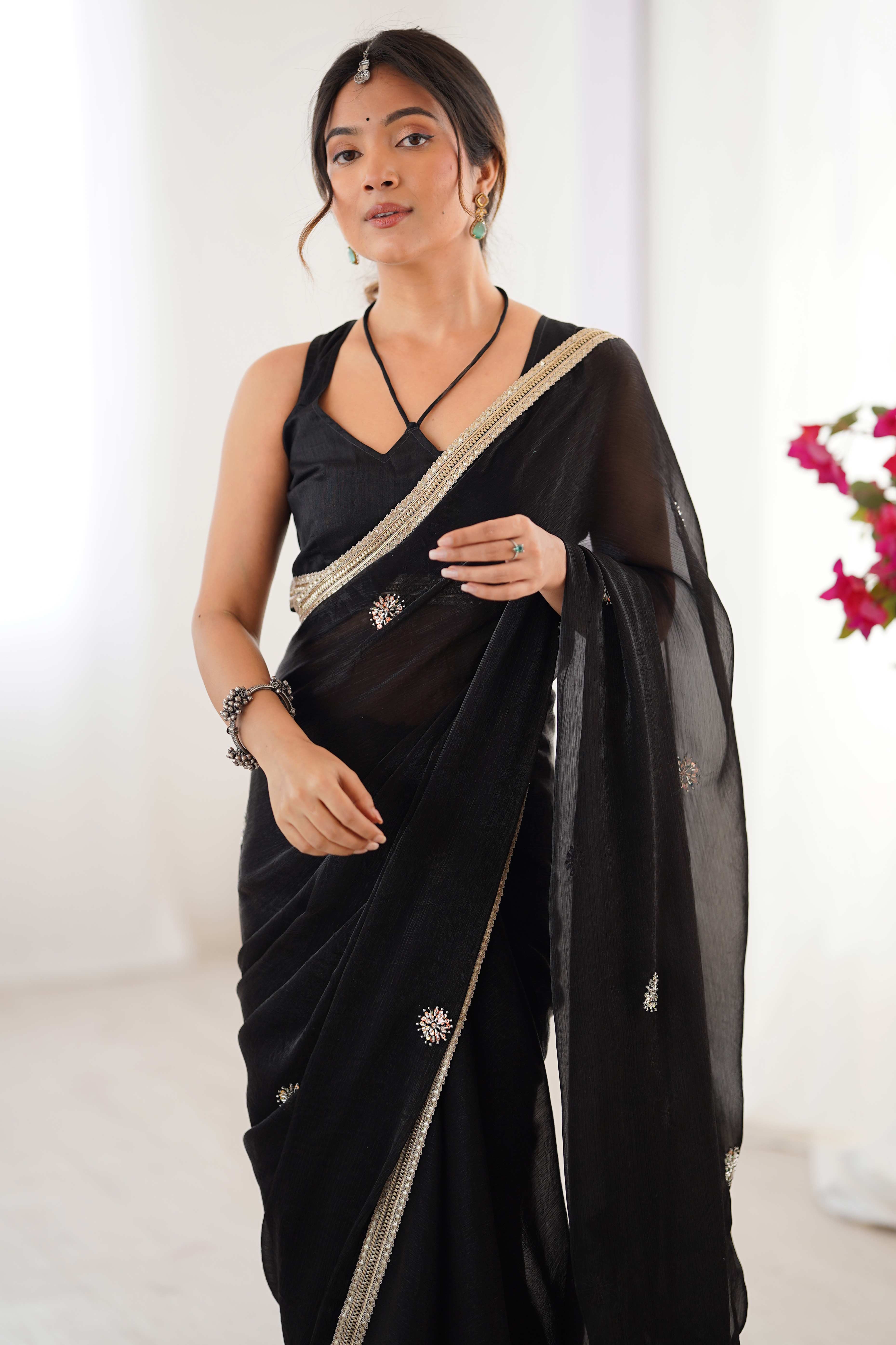 Elegant Black Organza Saree with Delicate Floral Embellishments and Lace Border
