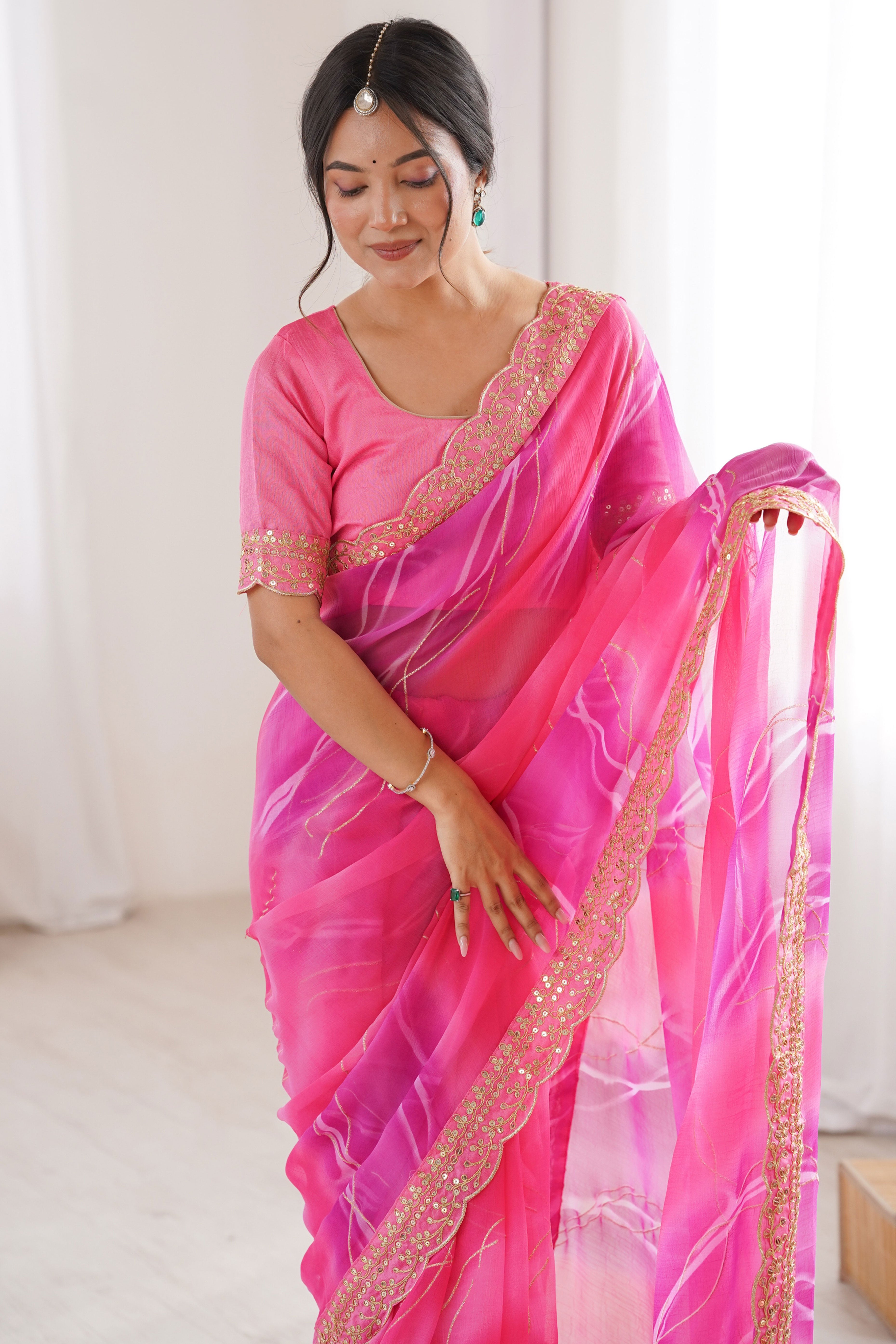 Graceful Pink Foil Print Georgette Saree Featuring A Luxurious Cording Sequins Embroidered Border