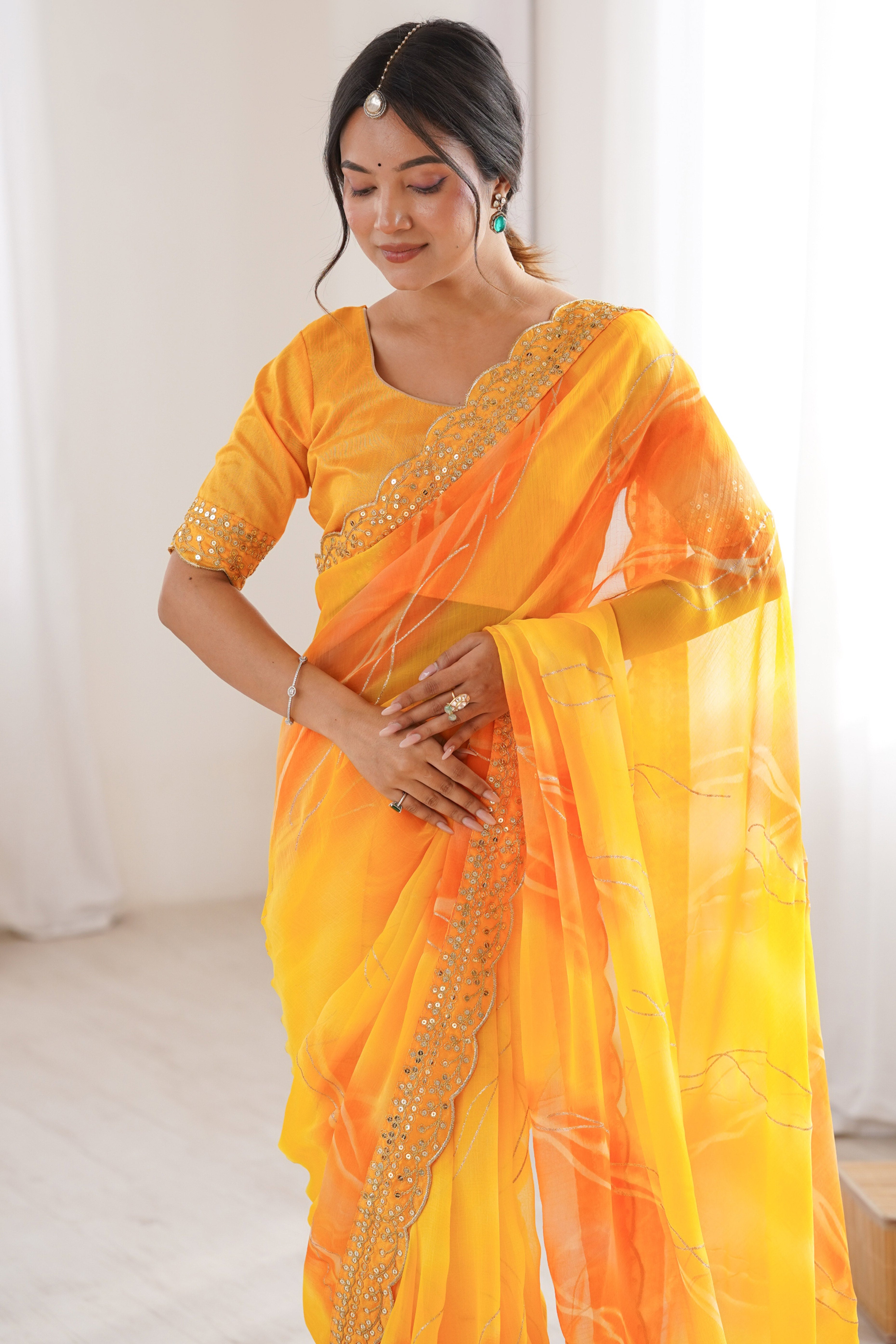 Graceful Yellow Foil Print Georgette Saree Featuring A Luxurious Cording Sequins Embroidered Border