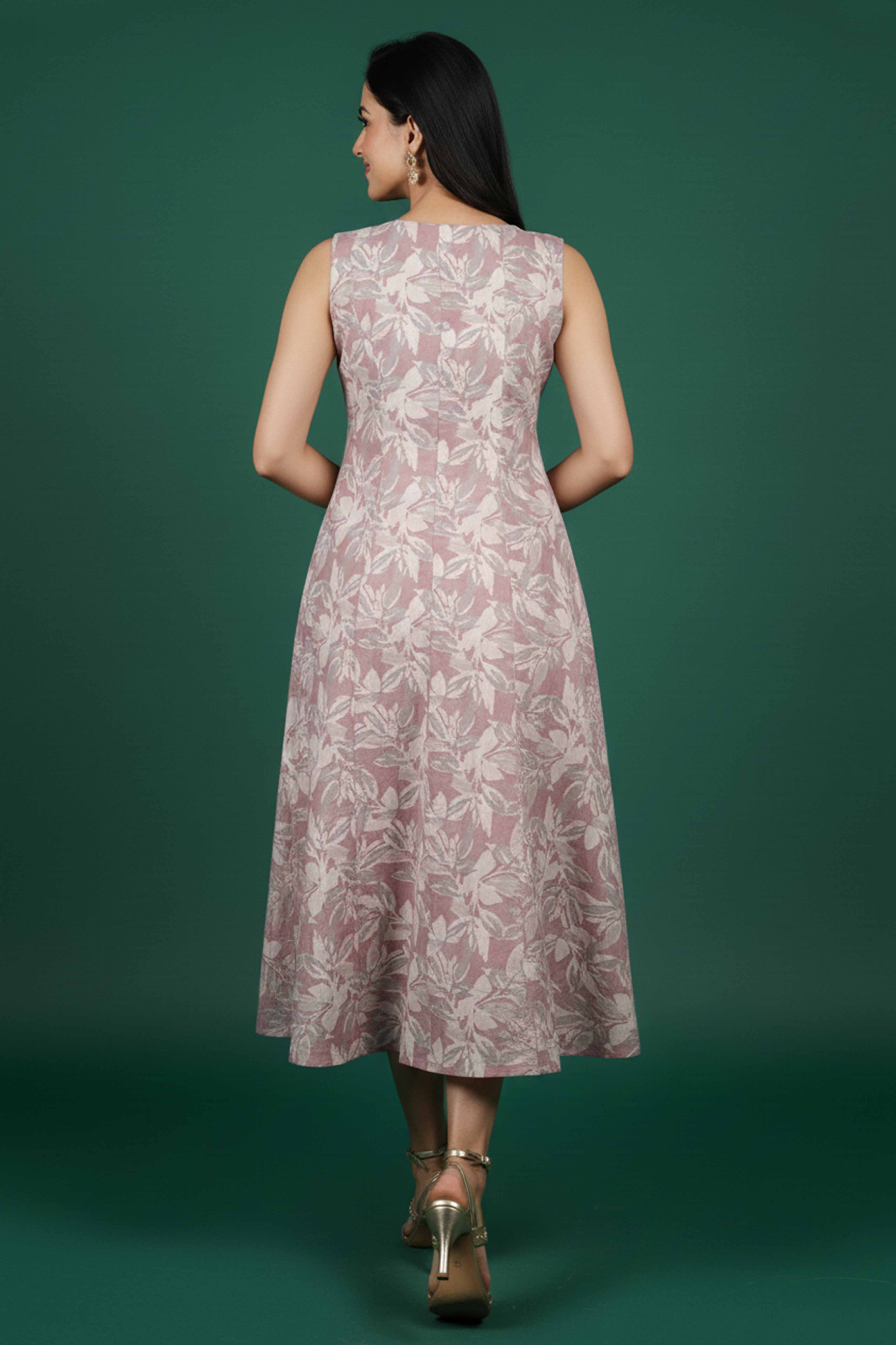 Stylish Peach Cotton Blend Dress Featuring Floral Prints & Sleeveless Cut With Pearl Button