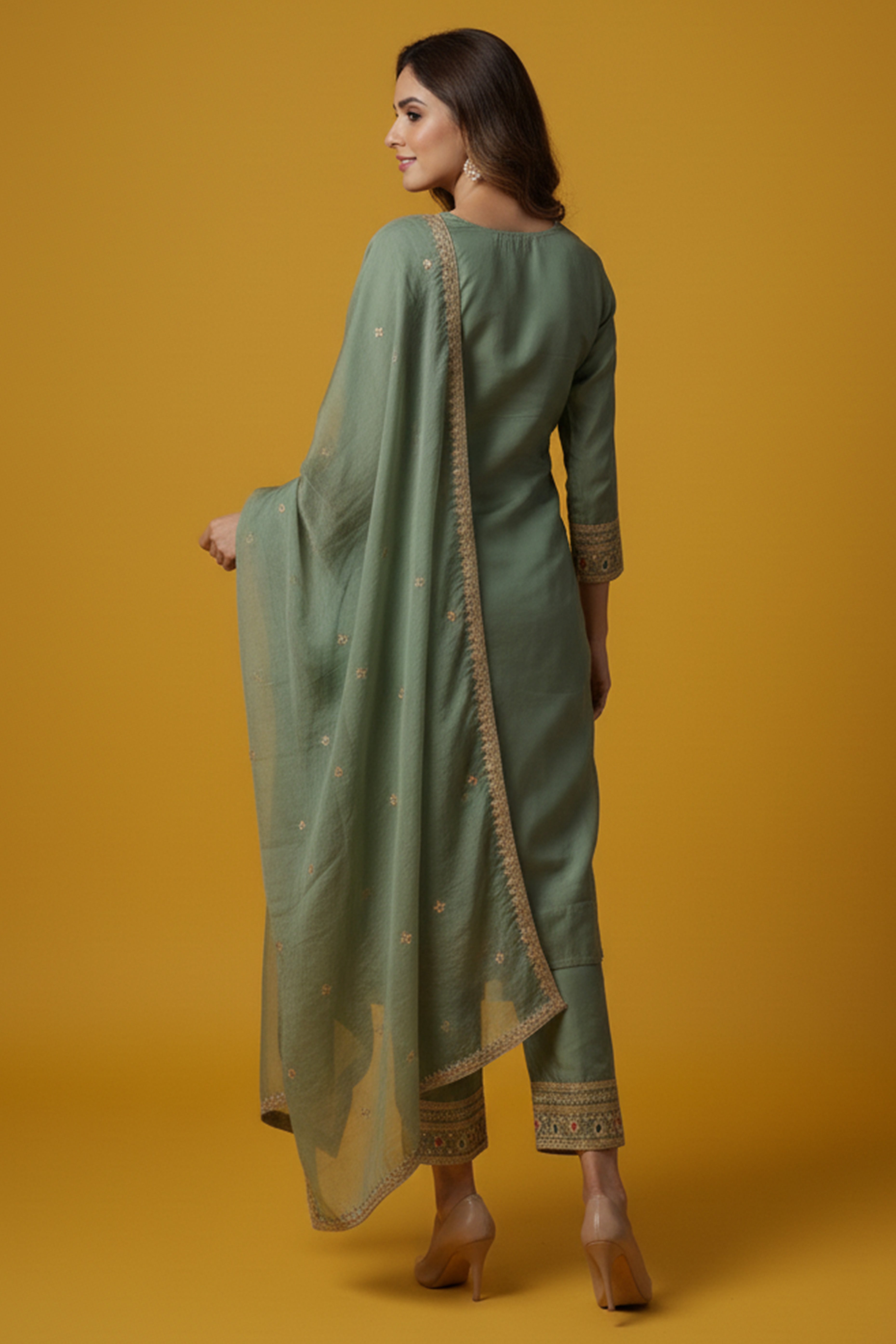 Green Organza Suit Accented with Thread & Sequins Work