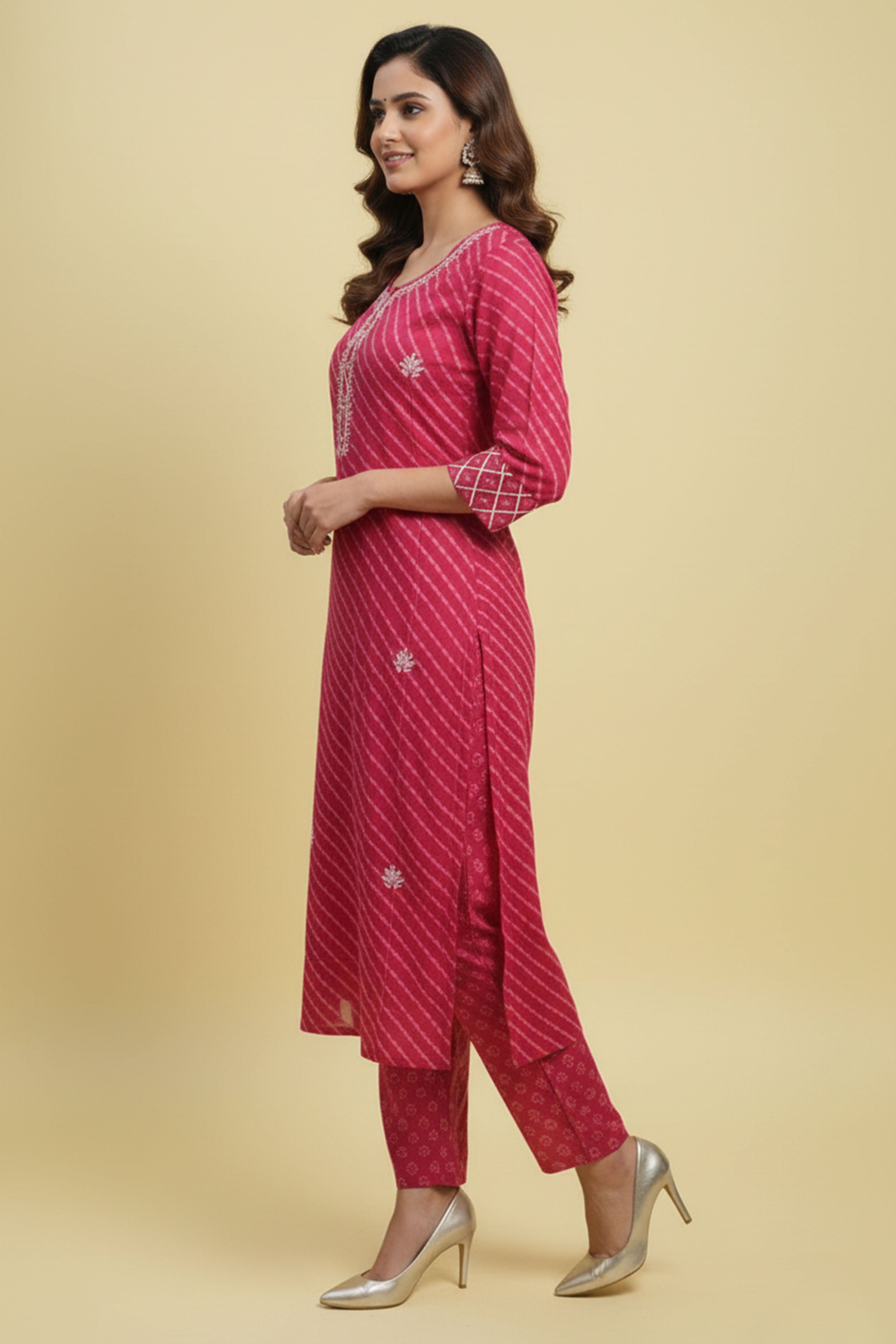 Graceful Pink Cotton Salwar Suit Highlighted with Leheriya Print and Thread Detailing