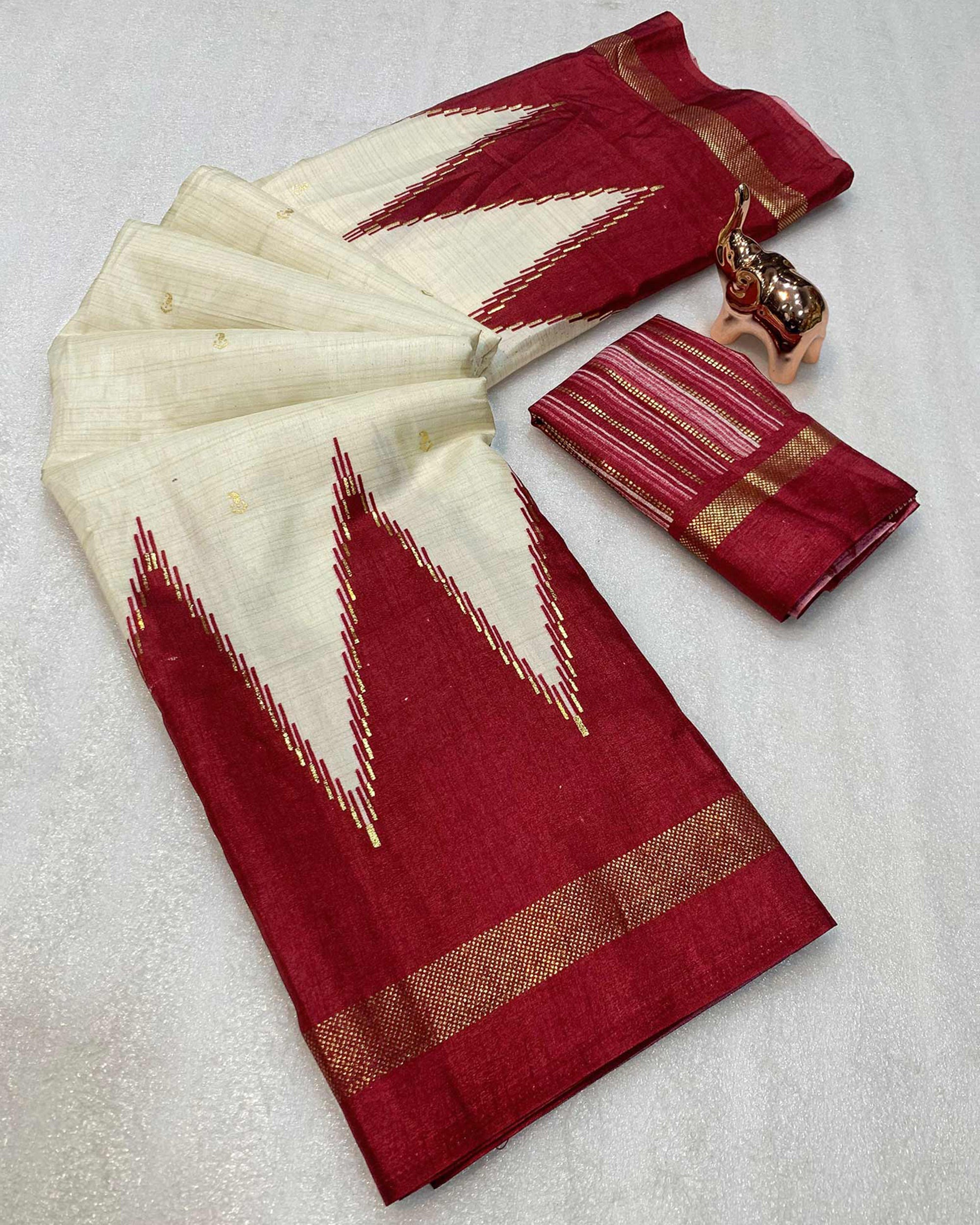 Subtle & Stylish Cream Saree With Ikkat Prints In Luxe Dola Silk For Festive Wear