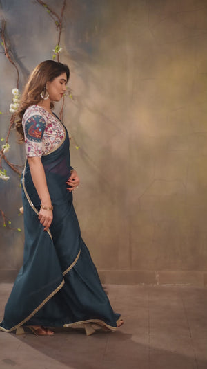 Morpich Blue Solid Sparkling Georgette Saree Enhanced With Shimmering Mirror Border