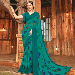 Adorable Rama Green Coloured Partywear Pure Georgette Floral Printed Saree With Fancy Lace Border - Peachmode