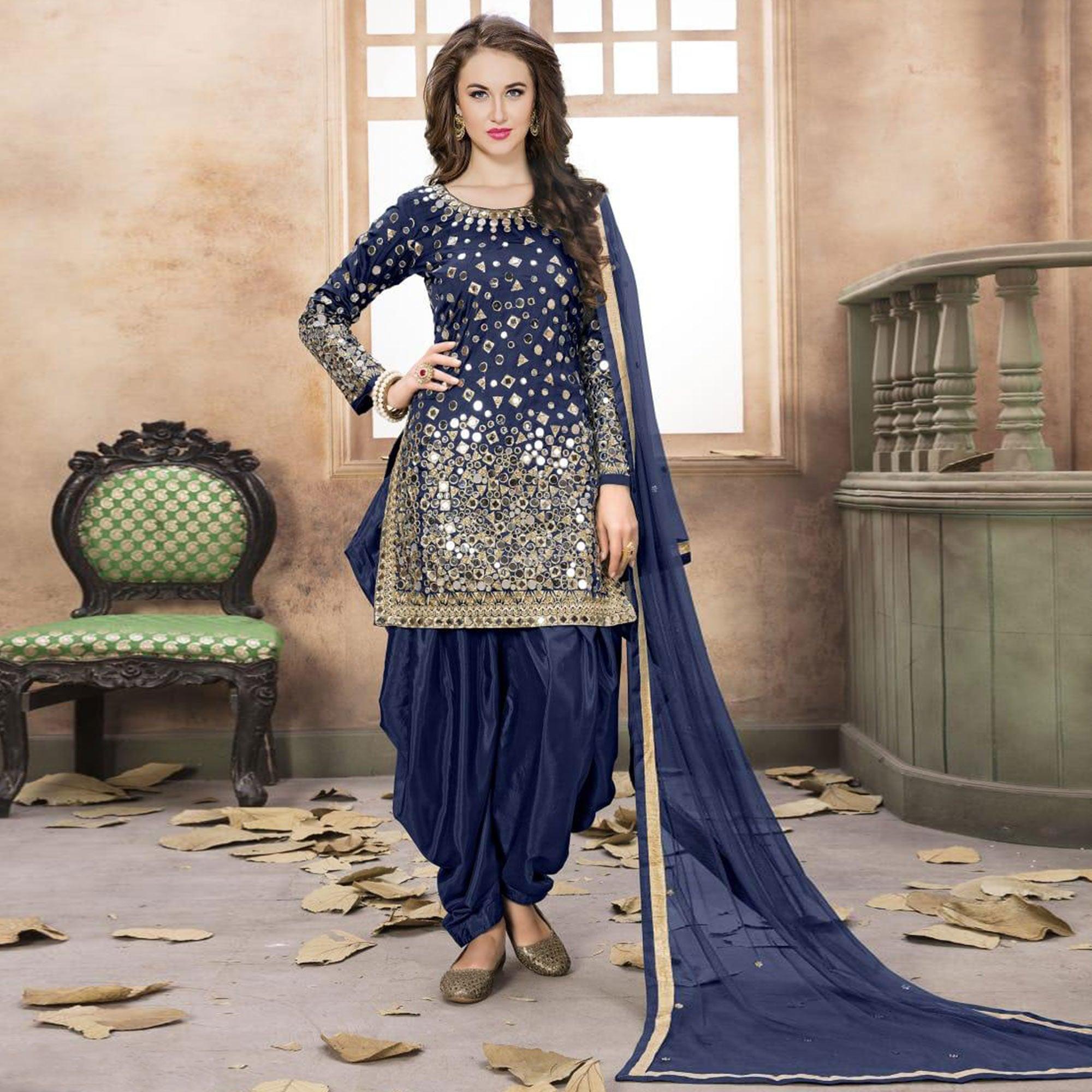 Adorning Navy Blue Colored Partywear Embroidered Tapeta Silk Patiala Suit - Peachmode
