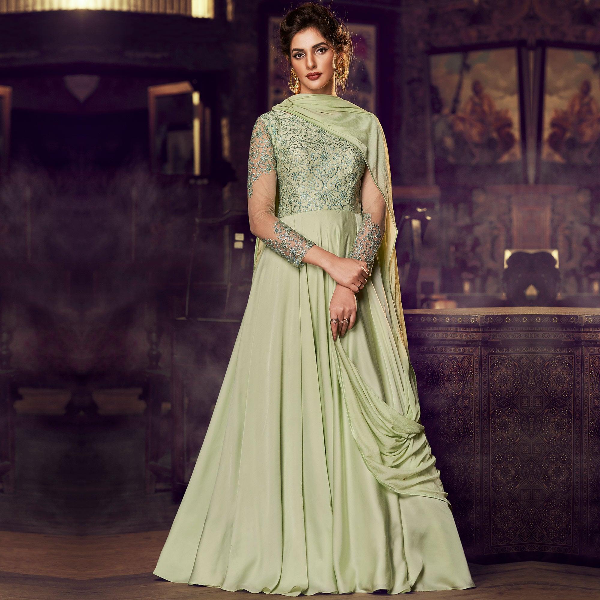 Adorning Pista Green Colored Partywear Embroidered Modal Satin Gown With Dupatta - Peachmode