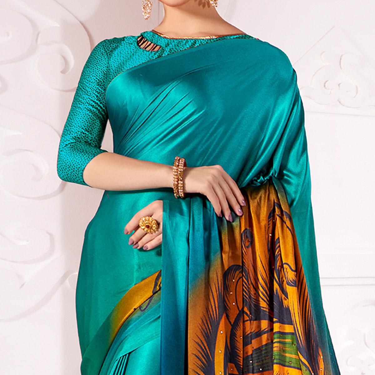 Alluring Rama Blue Colored Partywear Peacock Feather Printed Satin Saree - Peachmode