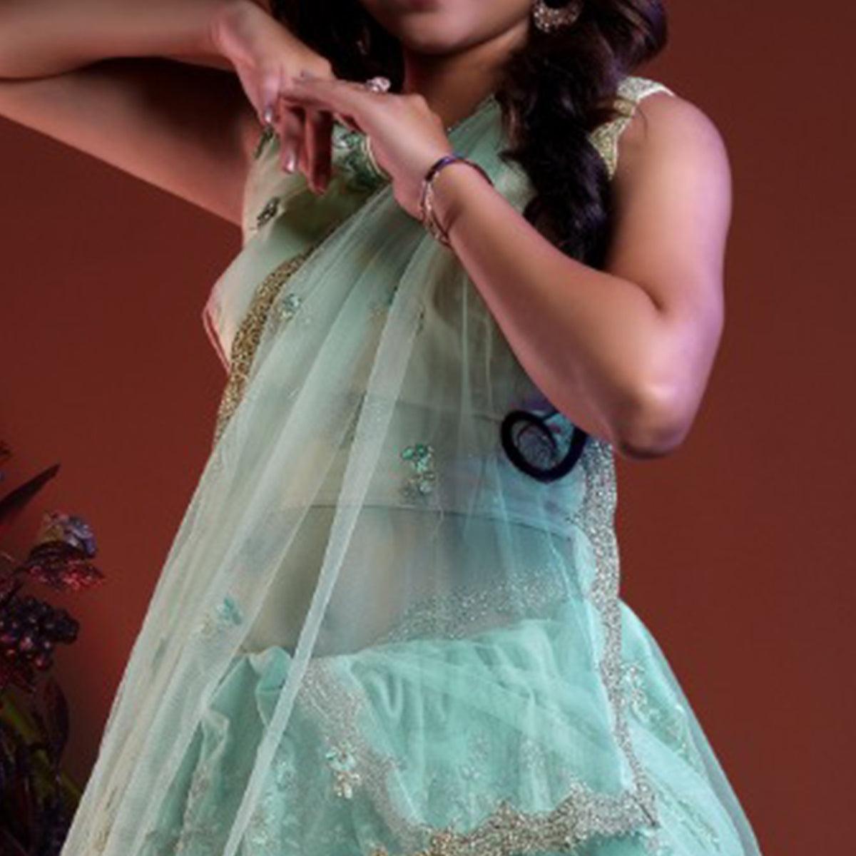 Aqua Blue Embroidered Netted Lehenga Choli - Peachmode