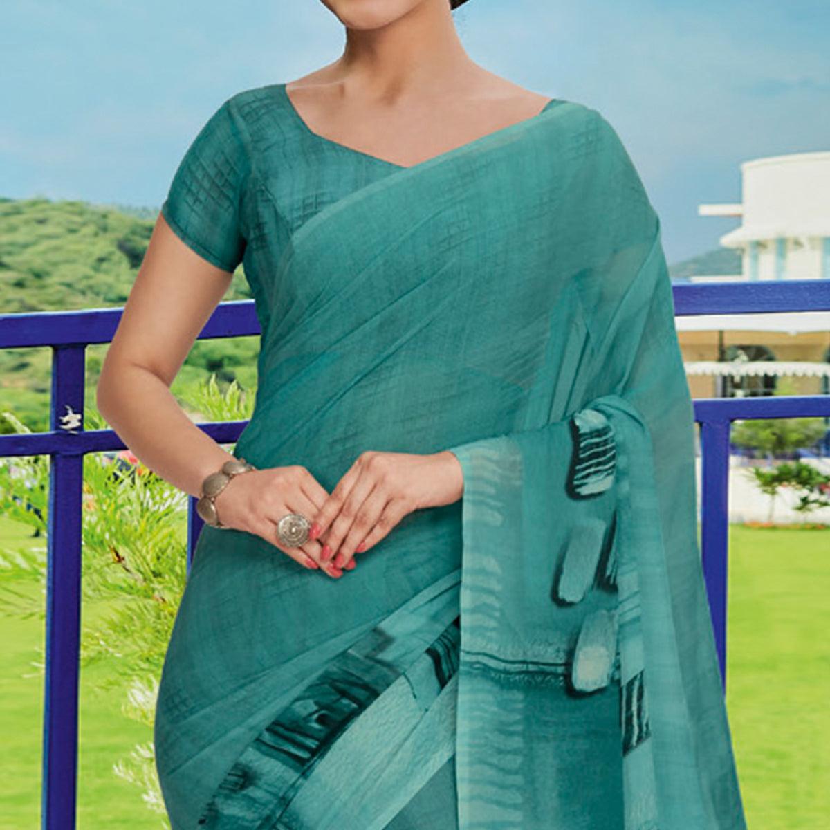 Aqua Blue Printed Georgette Saree - Peachmode