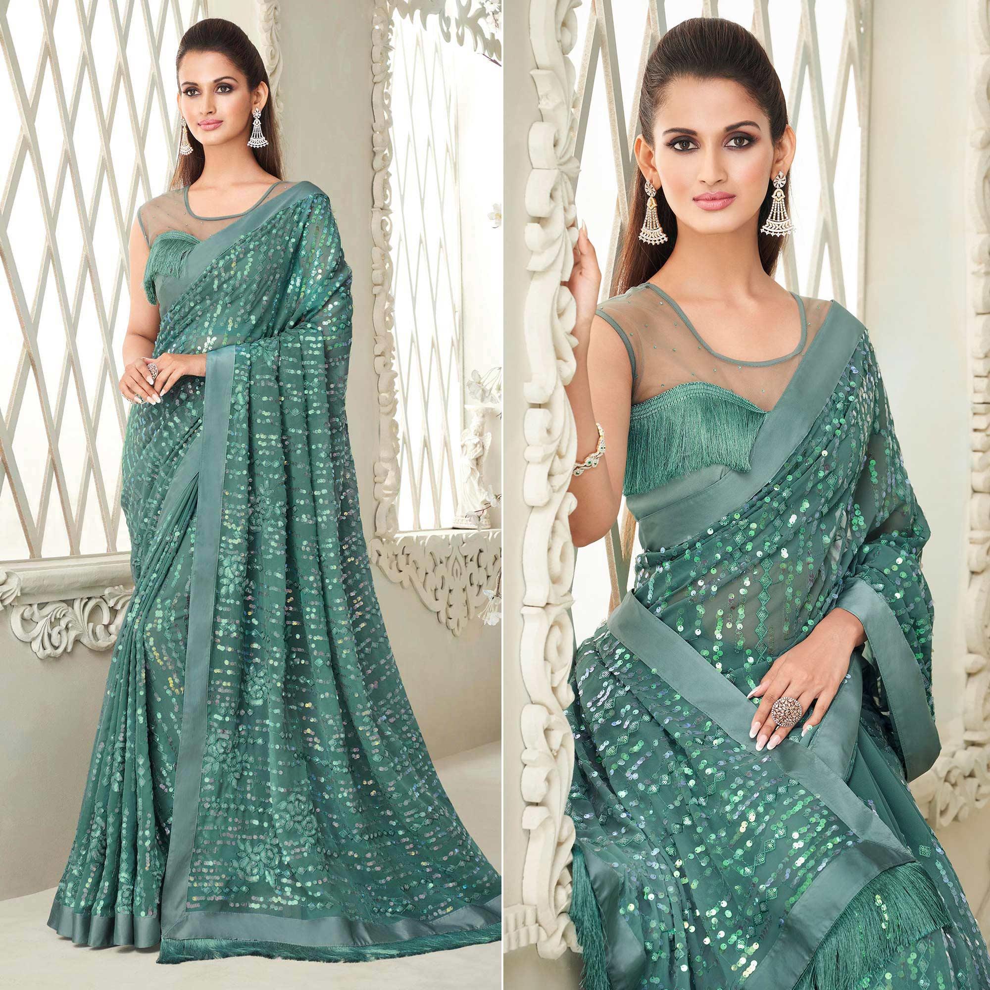 Aqua Blue Sequence Embroidered Georgette Saree With Tassels - Peachmode
