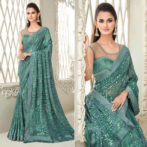 Aqua Blue Sequence Embroidered Georgette Saree With Tassels - Peachmode