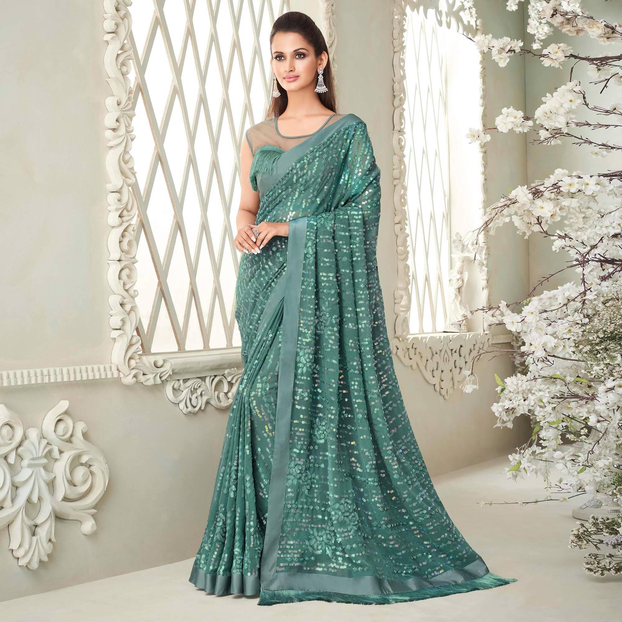 Aqua Blue Sequence Embroidered Georgette Saree With Tassels - Peachmode