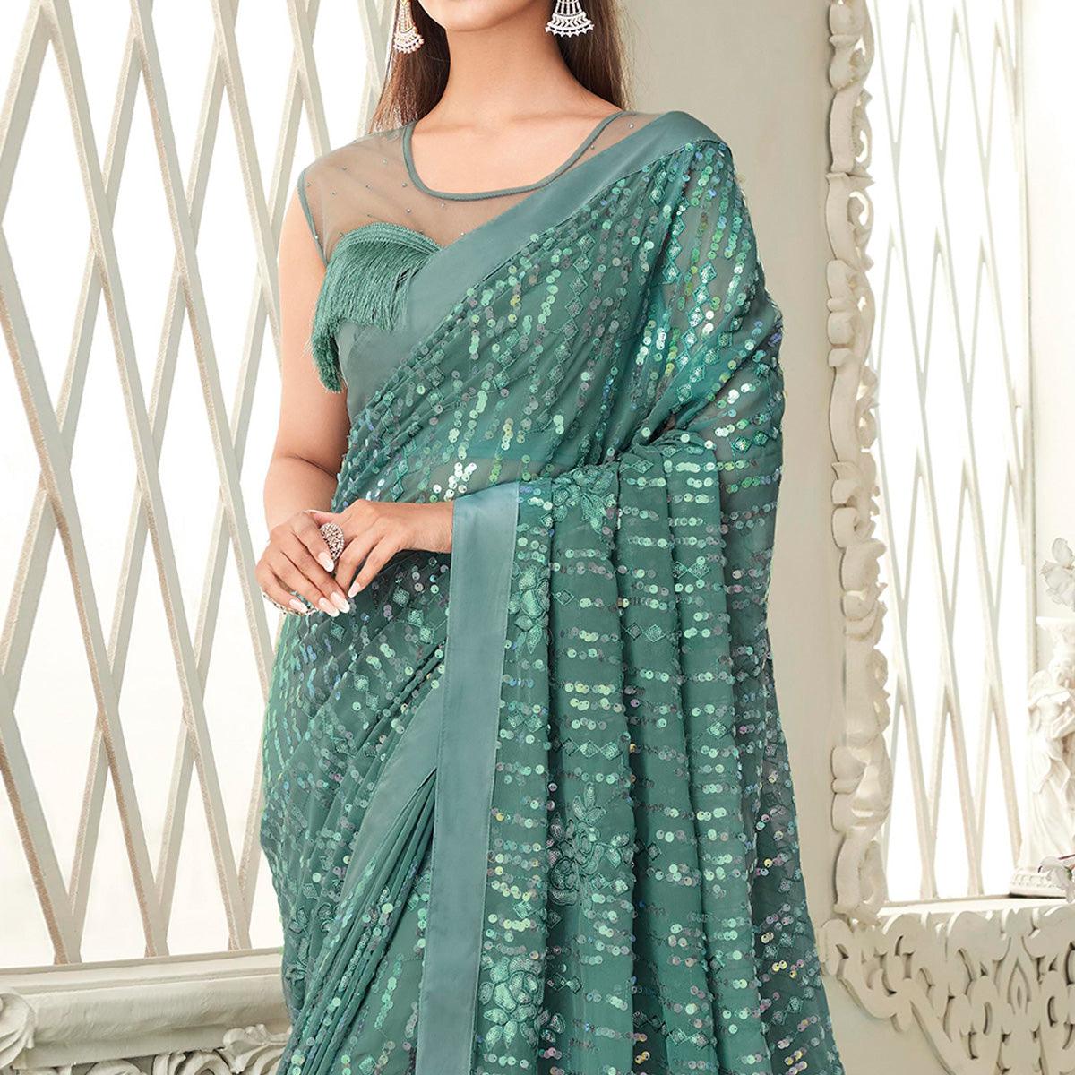 Aqua Blue Sequence Embroidered Georgette Saree With Tassels - Peachmode