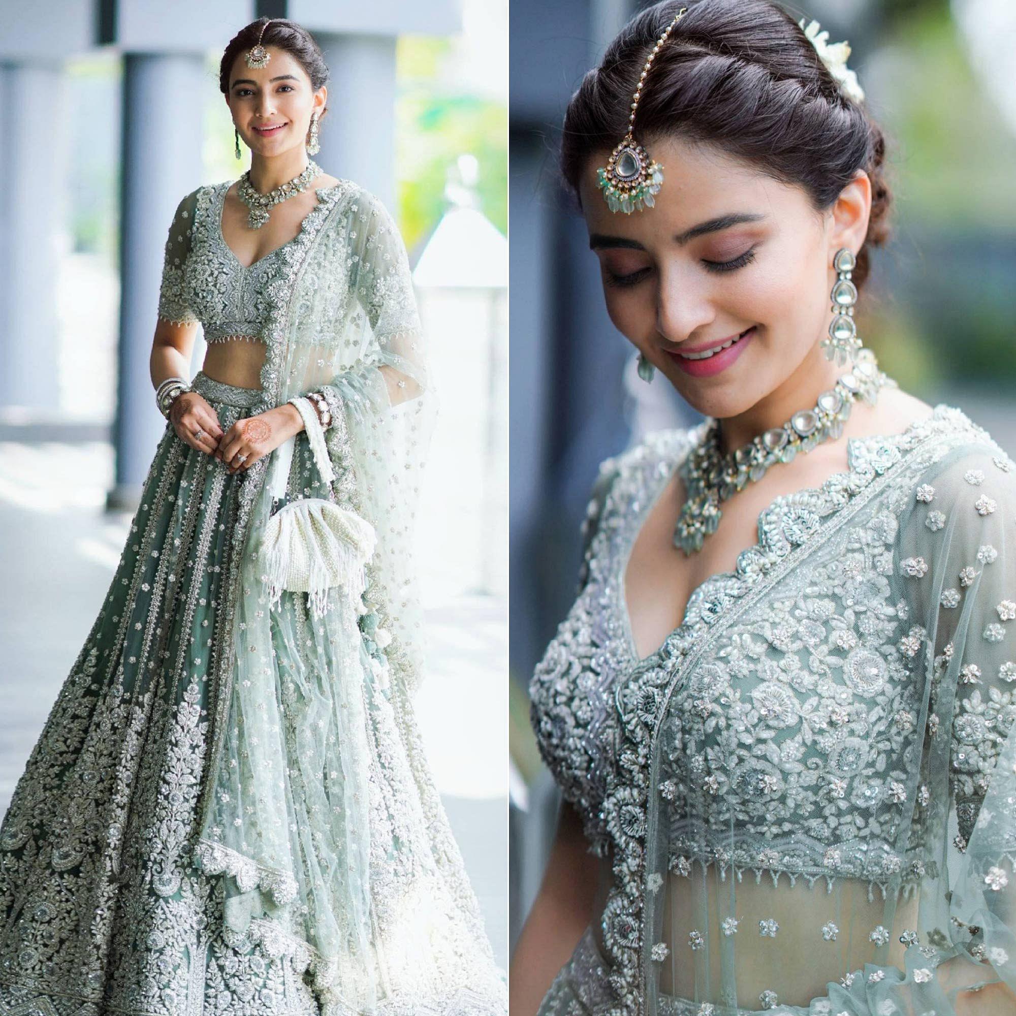 Aqua Green Party Wear Heavy Embroidered Netted Lehenga Choli - Peachmode
