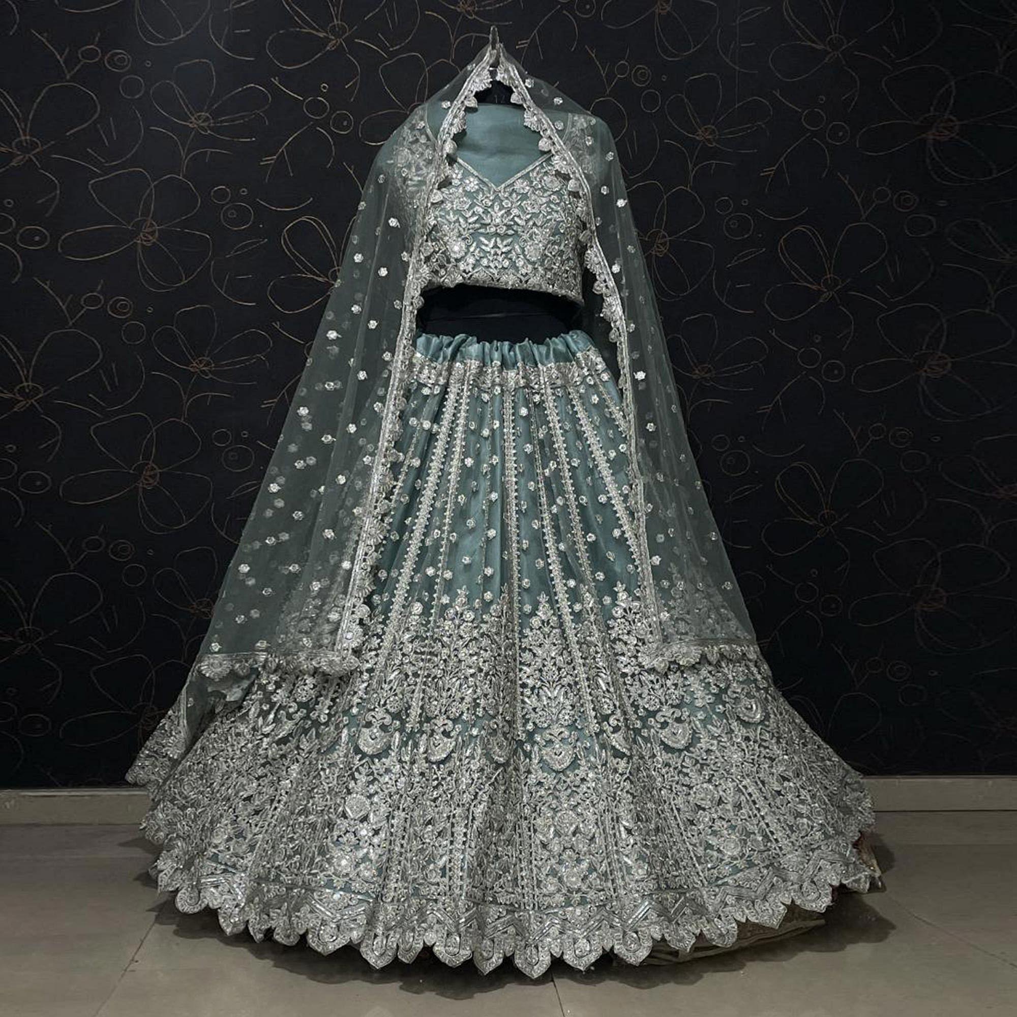 Aqua Green Party Wear Heavy Embroidered Netted Lehenga Choli - Peachmode