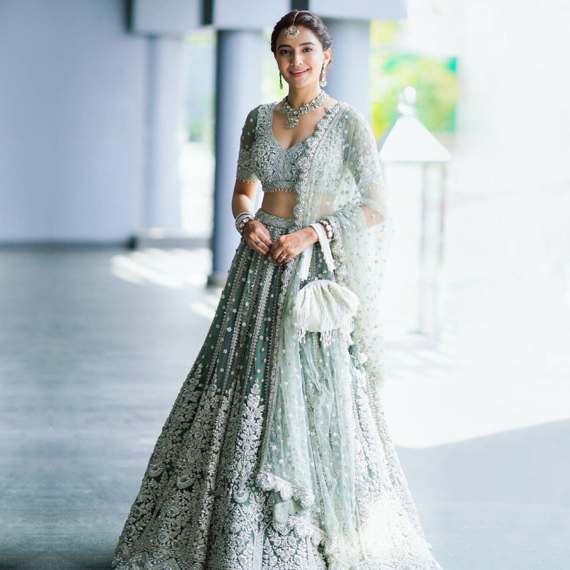 Aqua Green Party Wear Heavy Embroidered Netted Lehenga Choli - Peachmode