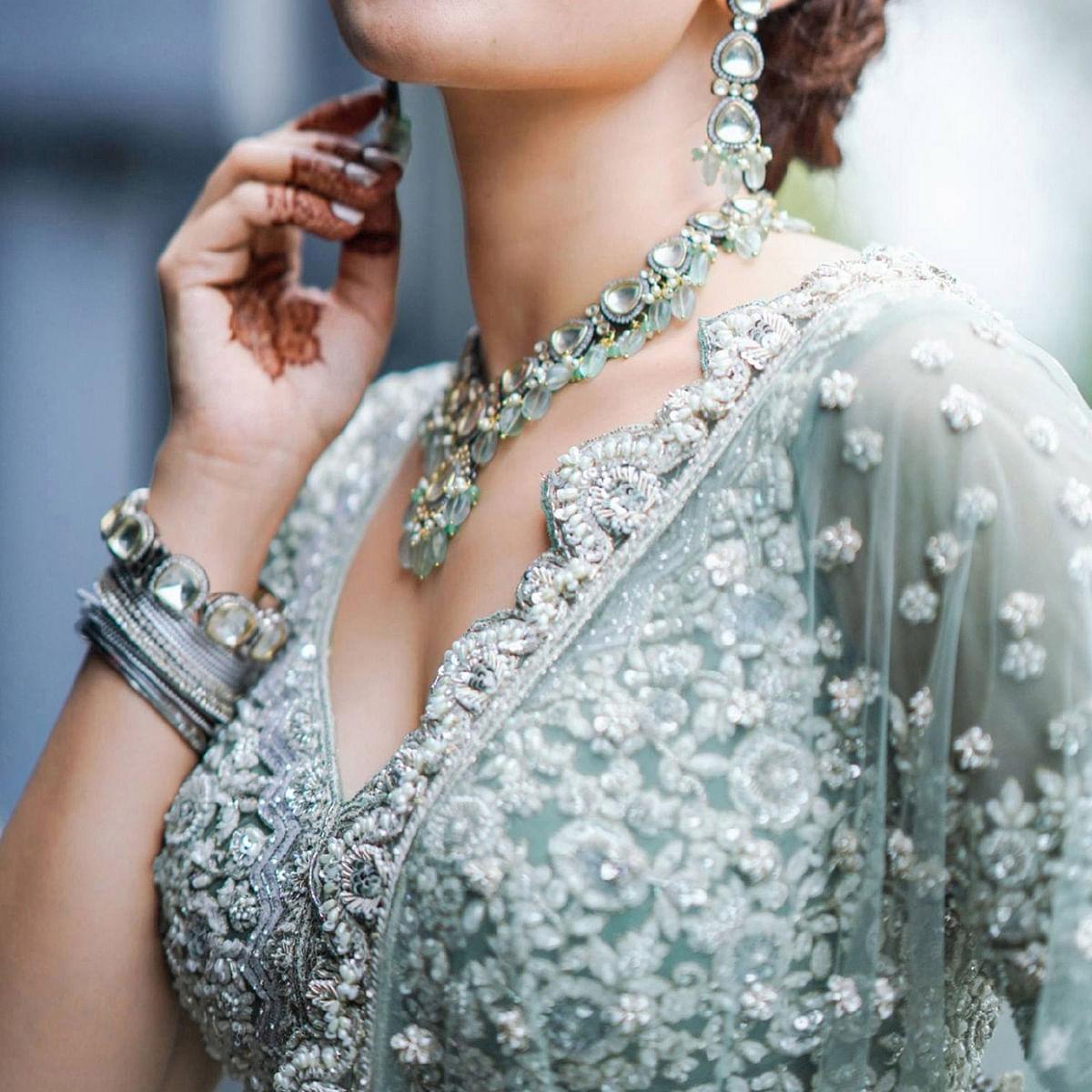 Aqua Green Party Wear Heavy Embroidered Netted Lehenga Choli - Peachmode