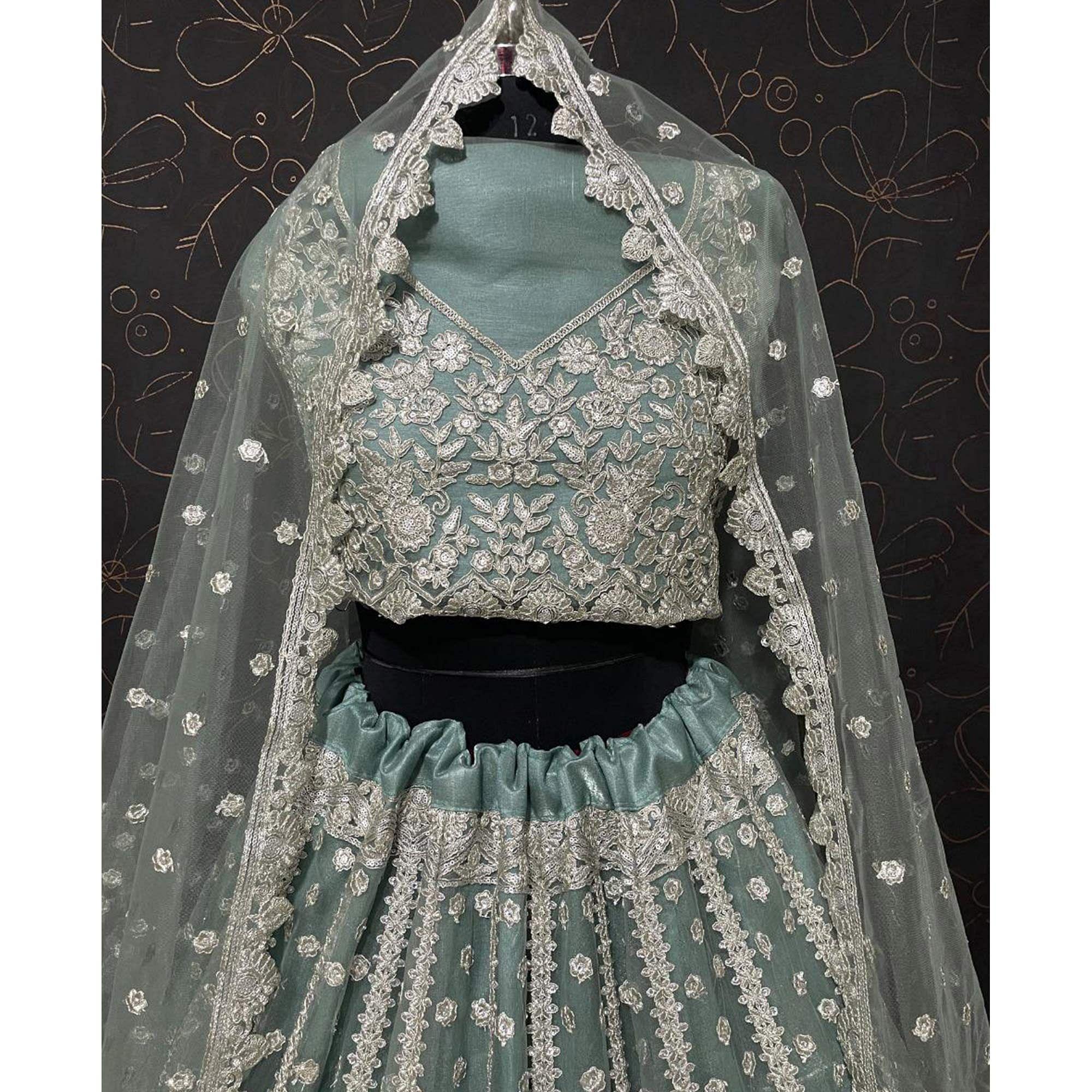 Aqua Green Party Wear Heavy Embroidered Netted Lehenga Choli - Peachmode