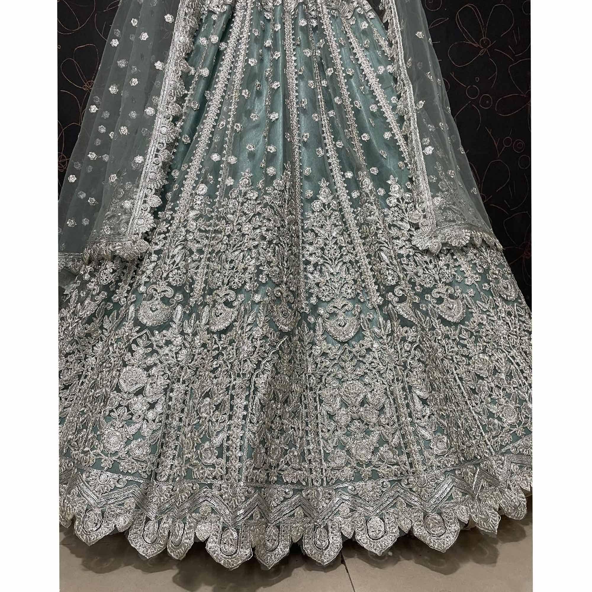 Aqua Green Party Wear Heavy Embroidered Netted Lehenga Choli - Peachmode