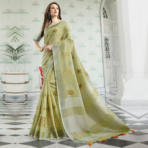 Arresting Pastel Green Colored Casual Wear Floral Embroidered Linen-Cotton Saree With Tassels - Peachmode