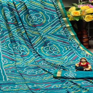 Beautiful Turquoise Blue Colored Festive Wear Woven Moss Georgette Saree - Peachmode