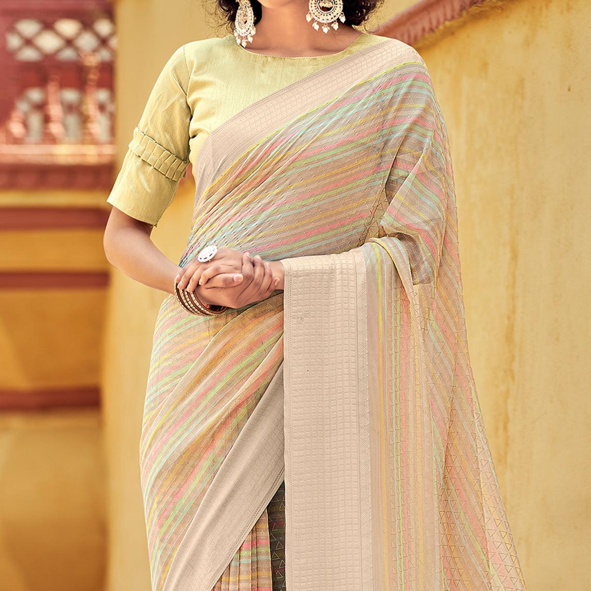 Beige Printed Georgette Saree With Tassels - Peachmode