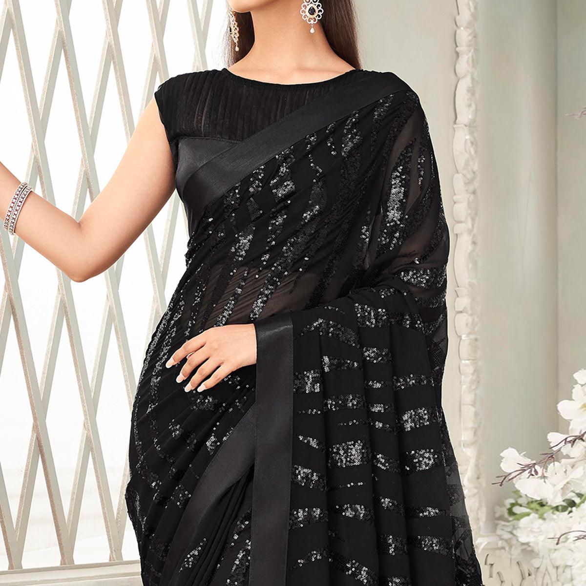Black Sequence Embroidered Georgette Saree With Tassels - Peachmode
