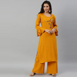 Blissta Women Mustard Solid Kurti With Plazzo With Hand Work Detailing - Peachmode