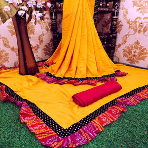 Blooming Mustard Colored Partywear Solid Vichitra Silk Saree With Bandhani Print Ruffle - Peachmode