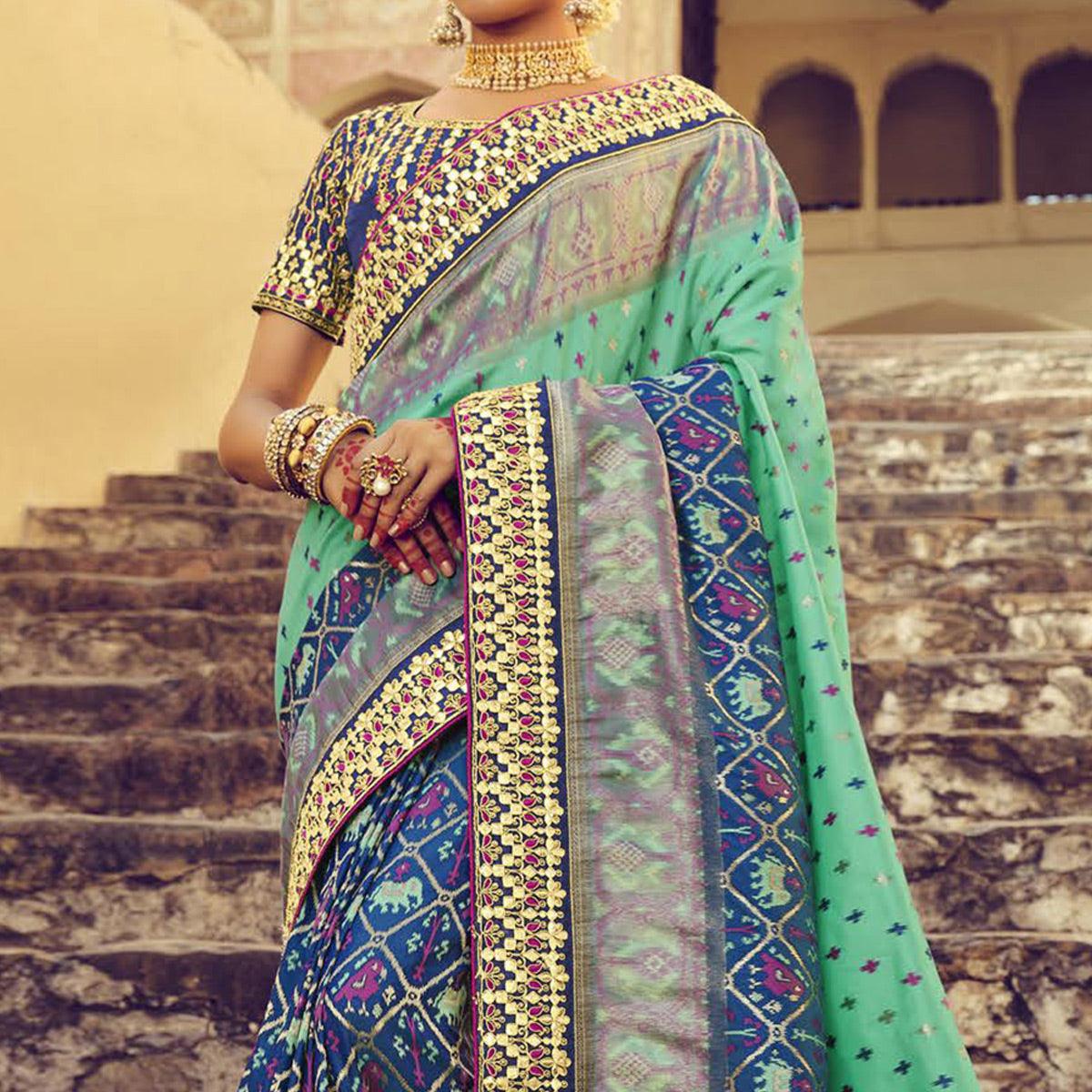 Blue & Turquoise Wedding Wear Resham With Embellished Silk Patola Saree - Peachmode