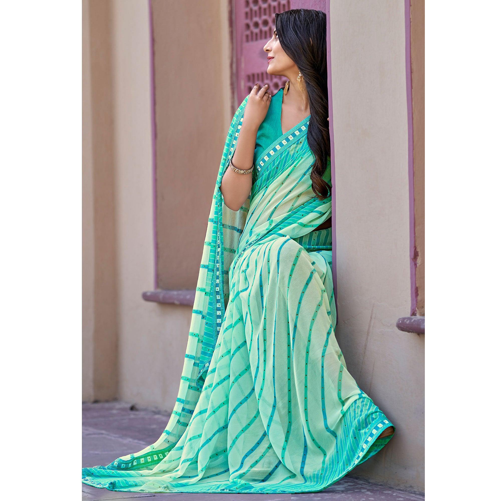 Blue Printed With Embellished Georgette Saree - Peachmode